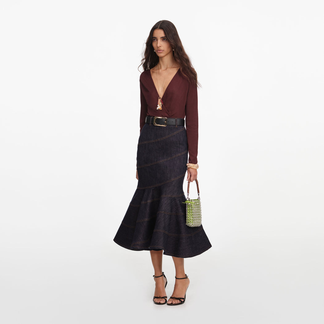 Side view of a woman wearing the Brown Viscose Knit Bodysuit