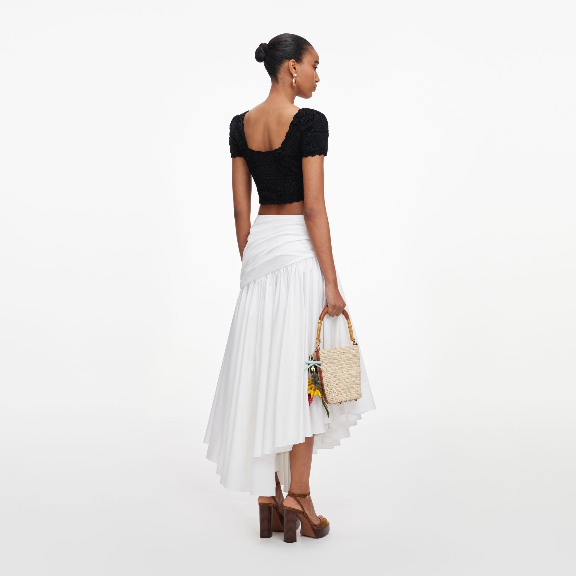 Back view of a woman wearing the Black Crochet Knit Crop Top