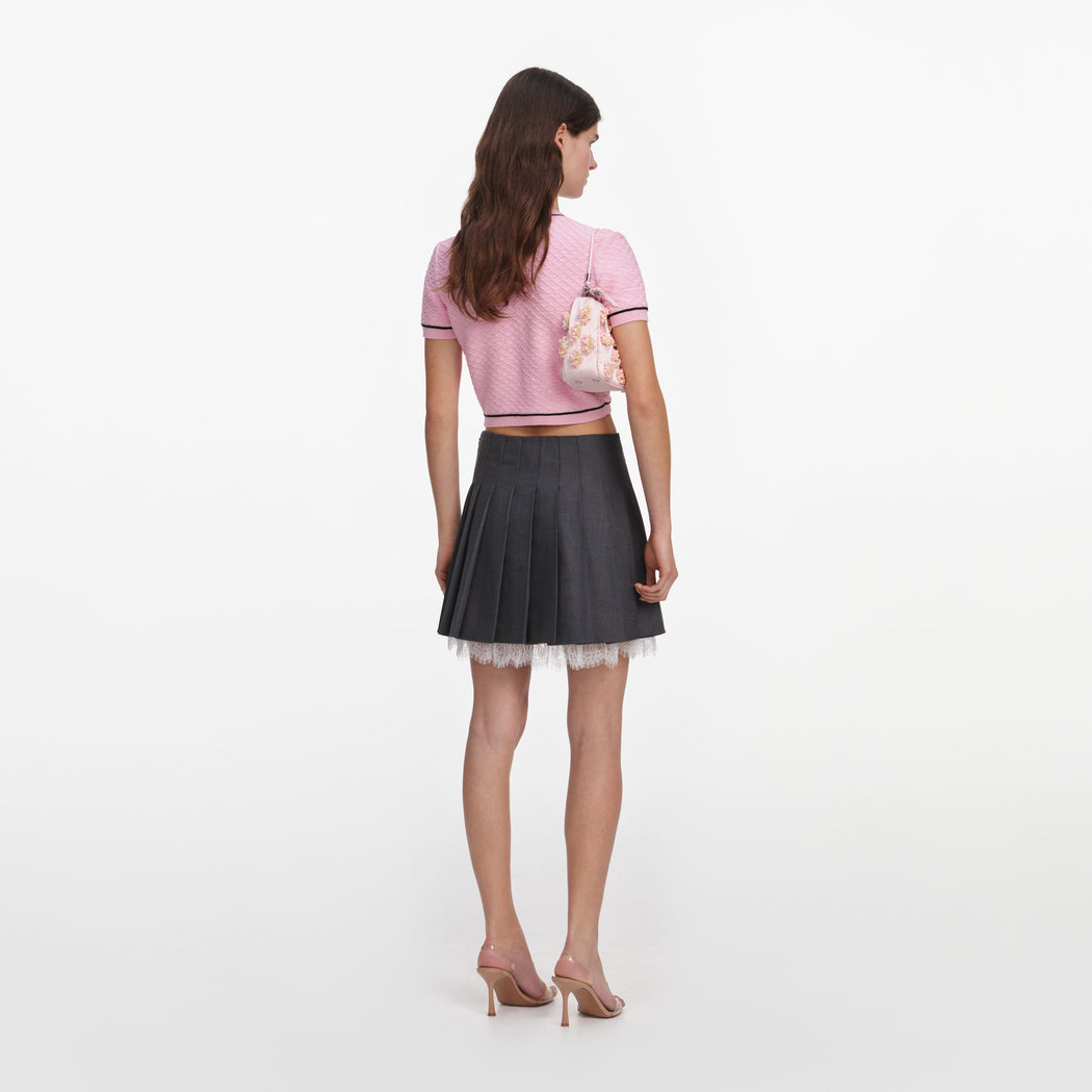 Back view of a woman wearing the Pink Flower Knit Top