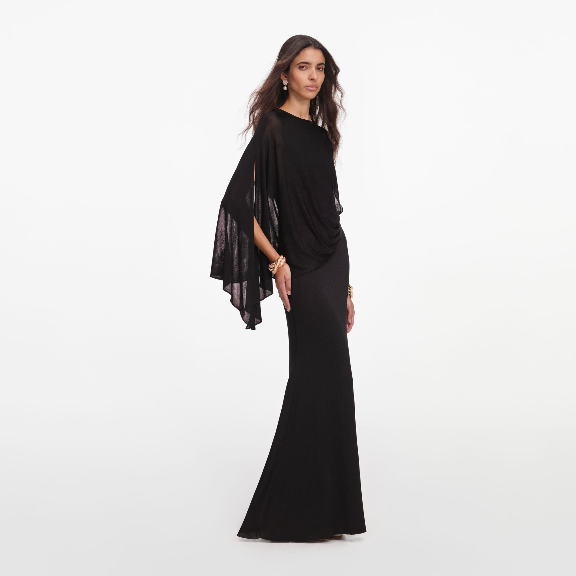 Side view of a woman wearing the Black Viscose Knit One Shoulder Maxi Dress