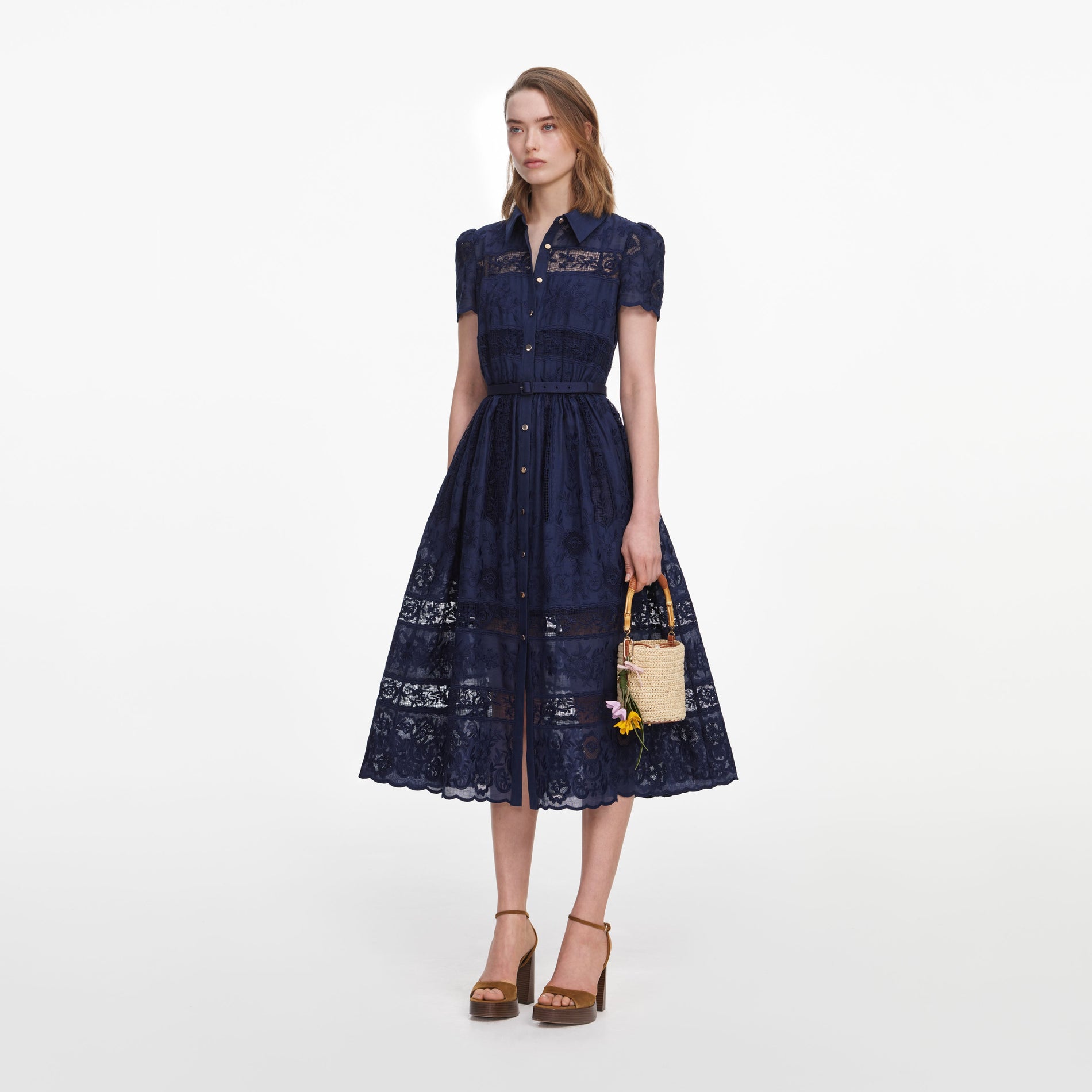 Side view of a woman wearing the Navy Ramie Collared Midi Dress