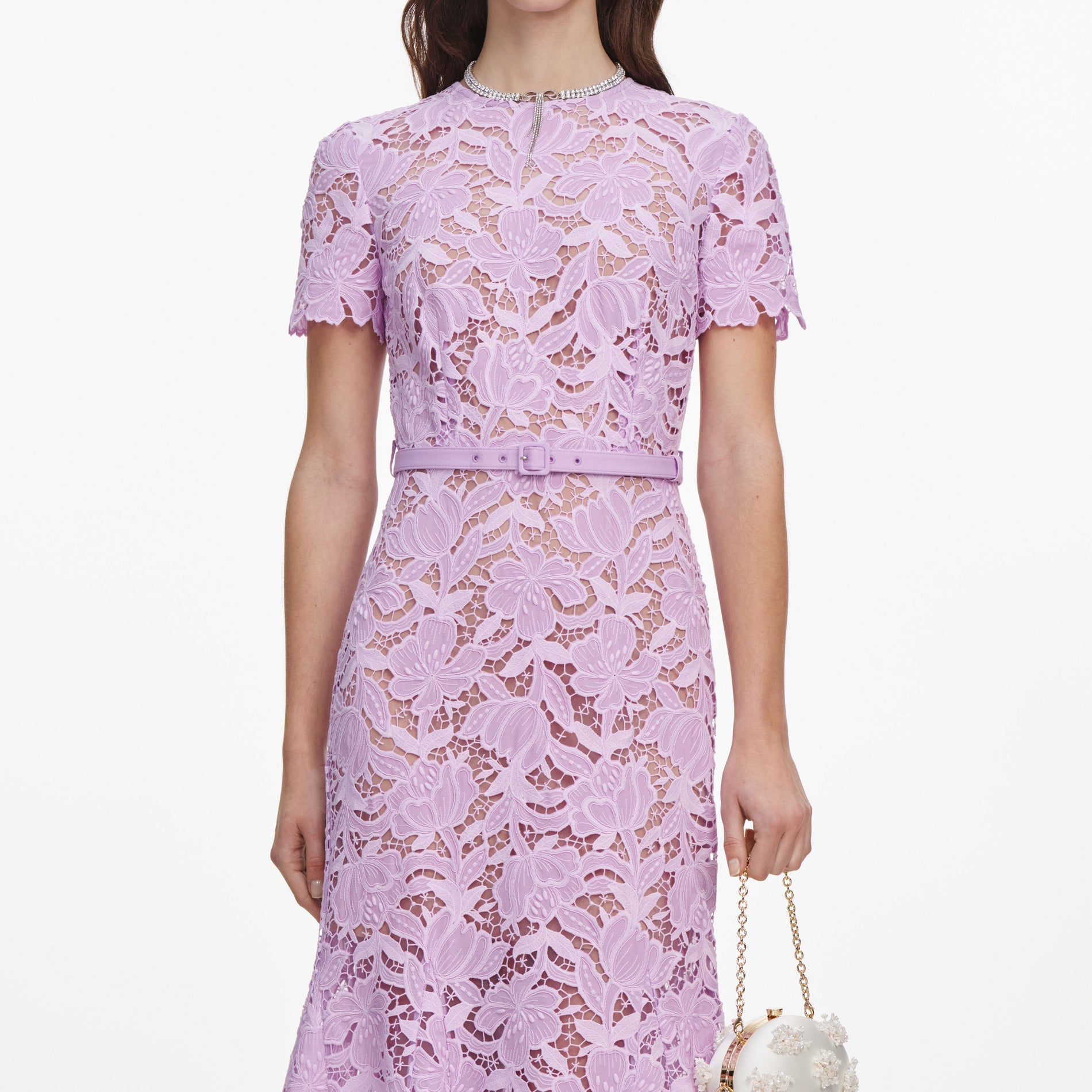 A close up of a woman wearing the Lilac Lace Midi Dress