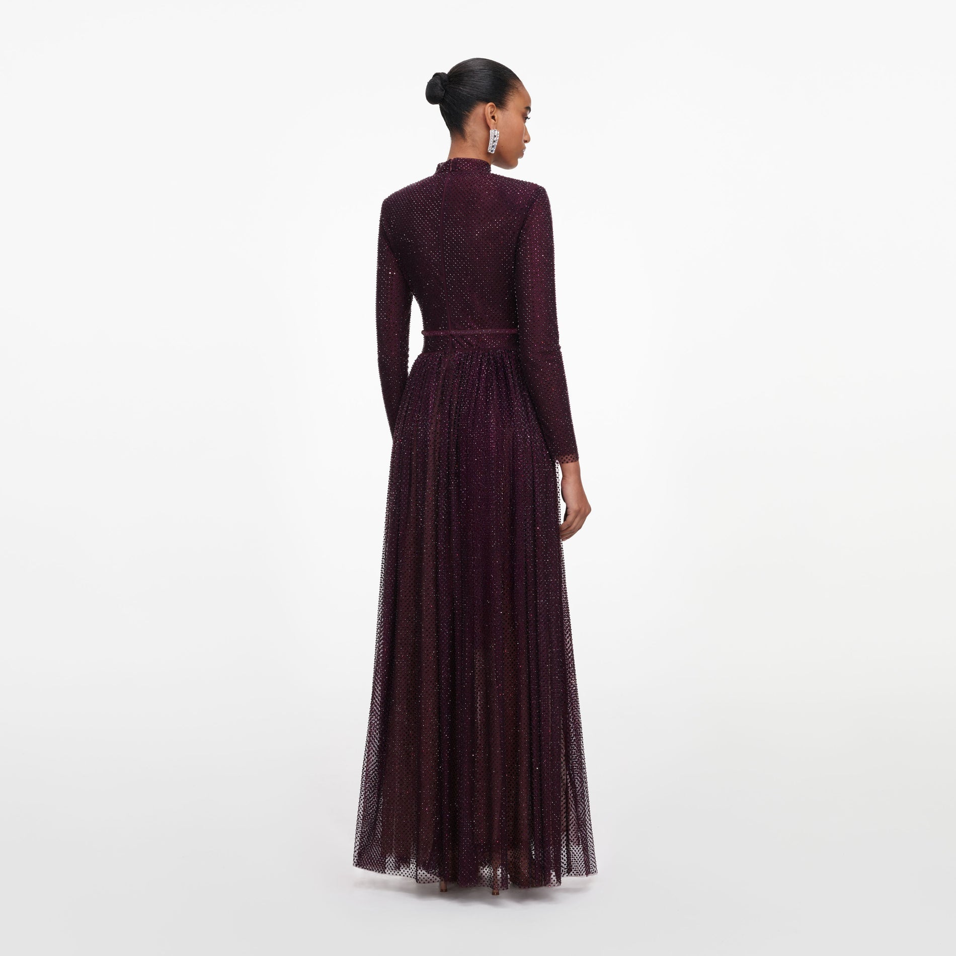 Back view of a woman wearing the Burgundy Rhinestone Long Sleeve Maxi Dress