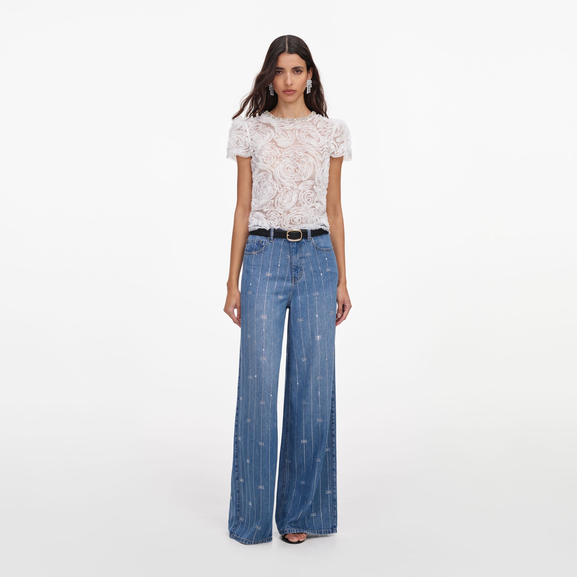 Front view of a woman wearing the Light Blue Rhinestone Stripe Denim Jeans