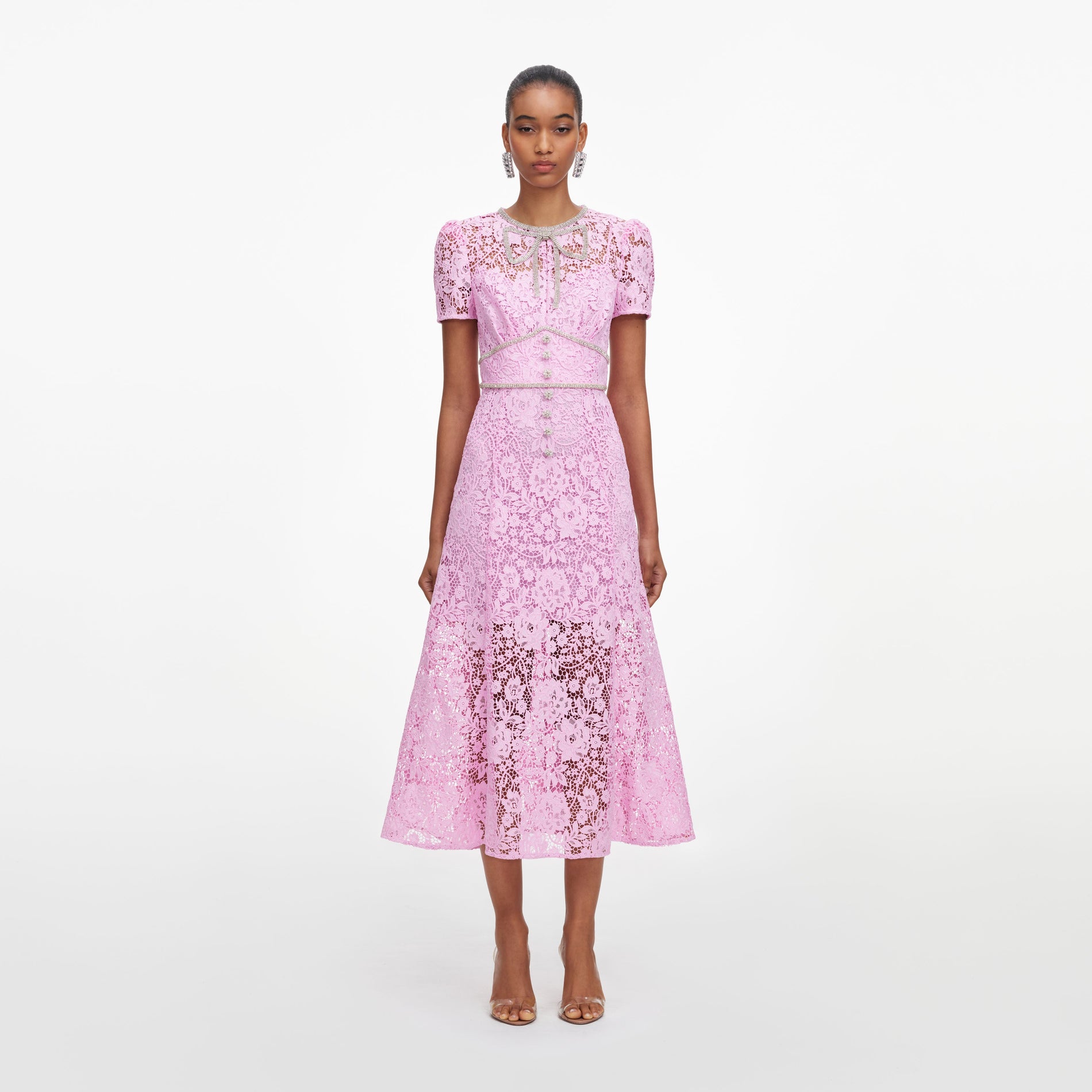 Front view of a woman wearing the Pink Cord Lace Midi Dress