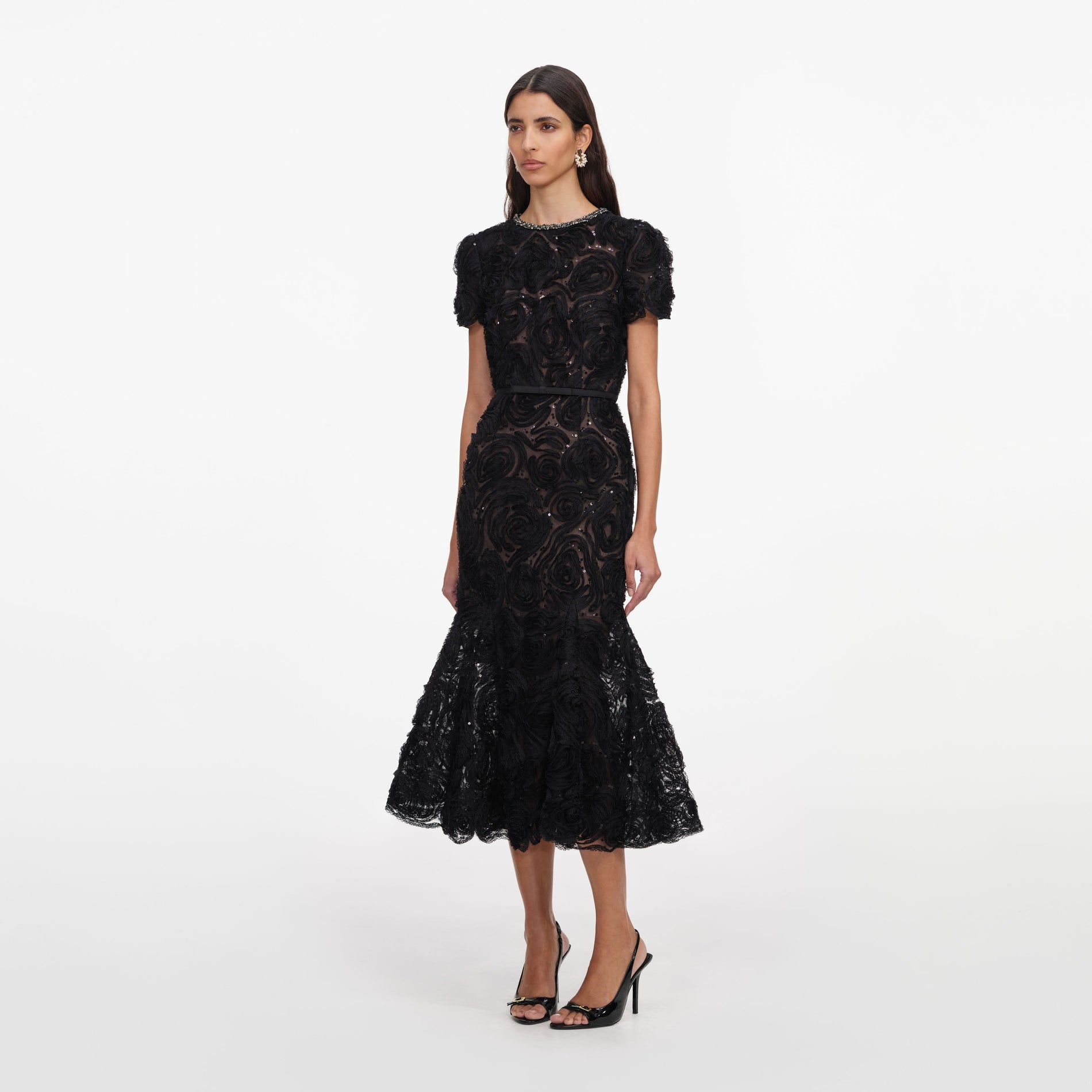 Side view of a woman wearing the Black Tulle Lace Midi Dress