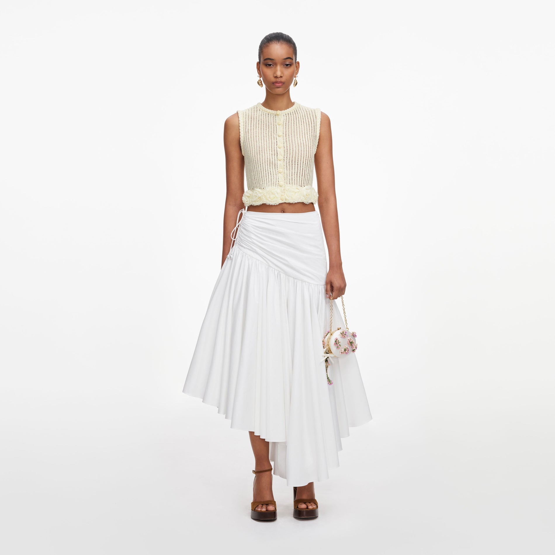 Front view of a woman wearing the Yellow Crochet Flower Knit Top