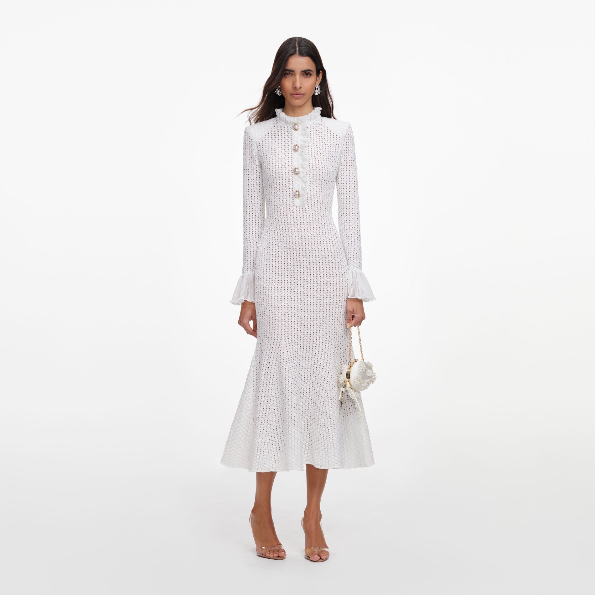 Front view of a woman wearing the White Pointelle Knit Flare Midi Dress