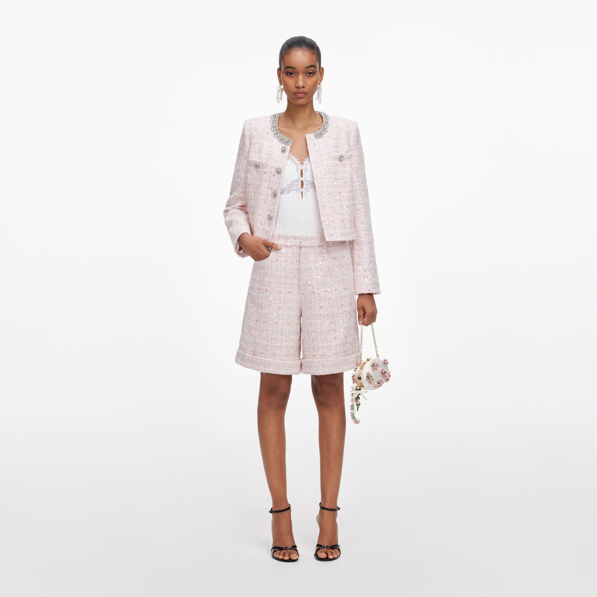 Front view of a woman wearing the Pink Sequin Boucle Shorts