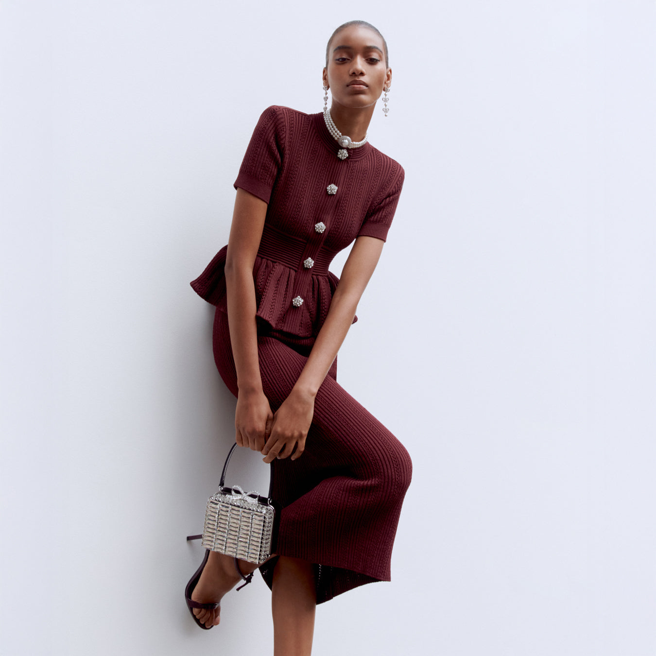 Front view of a woman wearing the Bordeaux Pointelle Knit Midi Dress