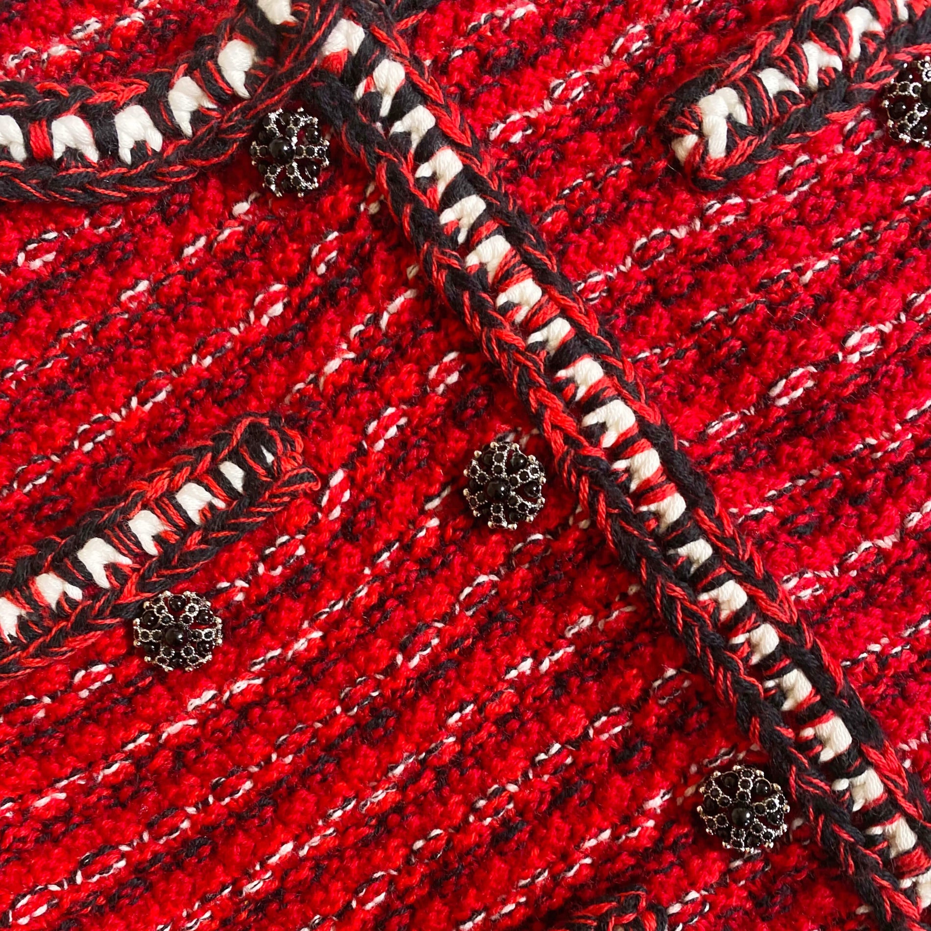 A close up of the fabric for the Red Melange Button Knit Cardigan