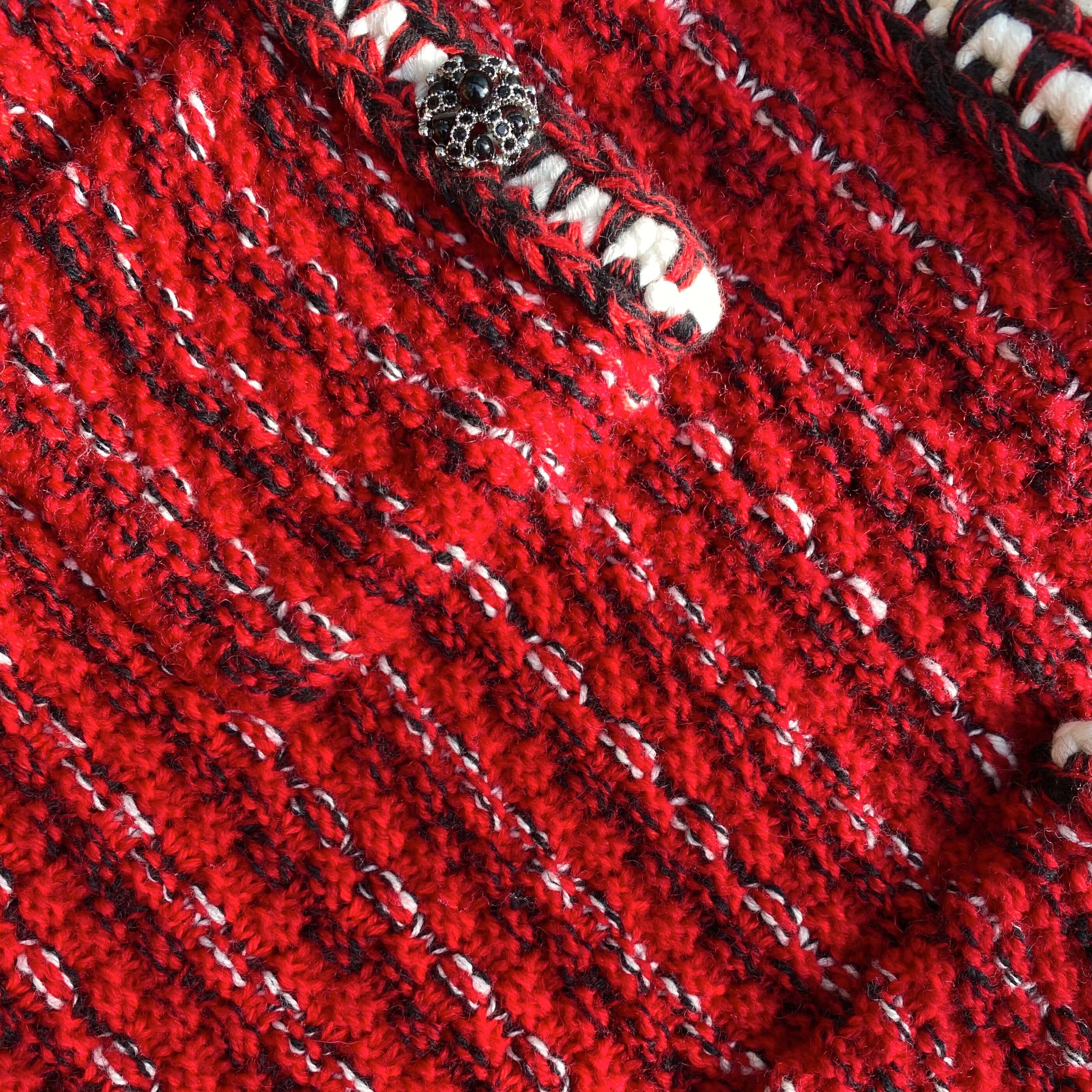 A close up of the fabric for the Red Melange Knit Mini Ruffle Skirt