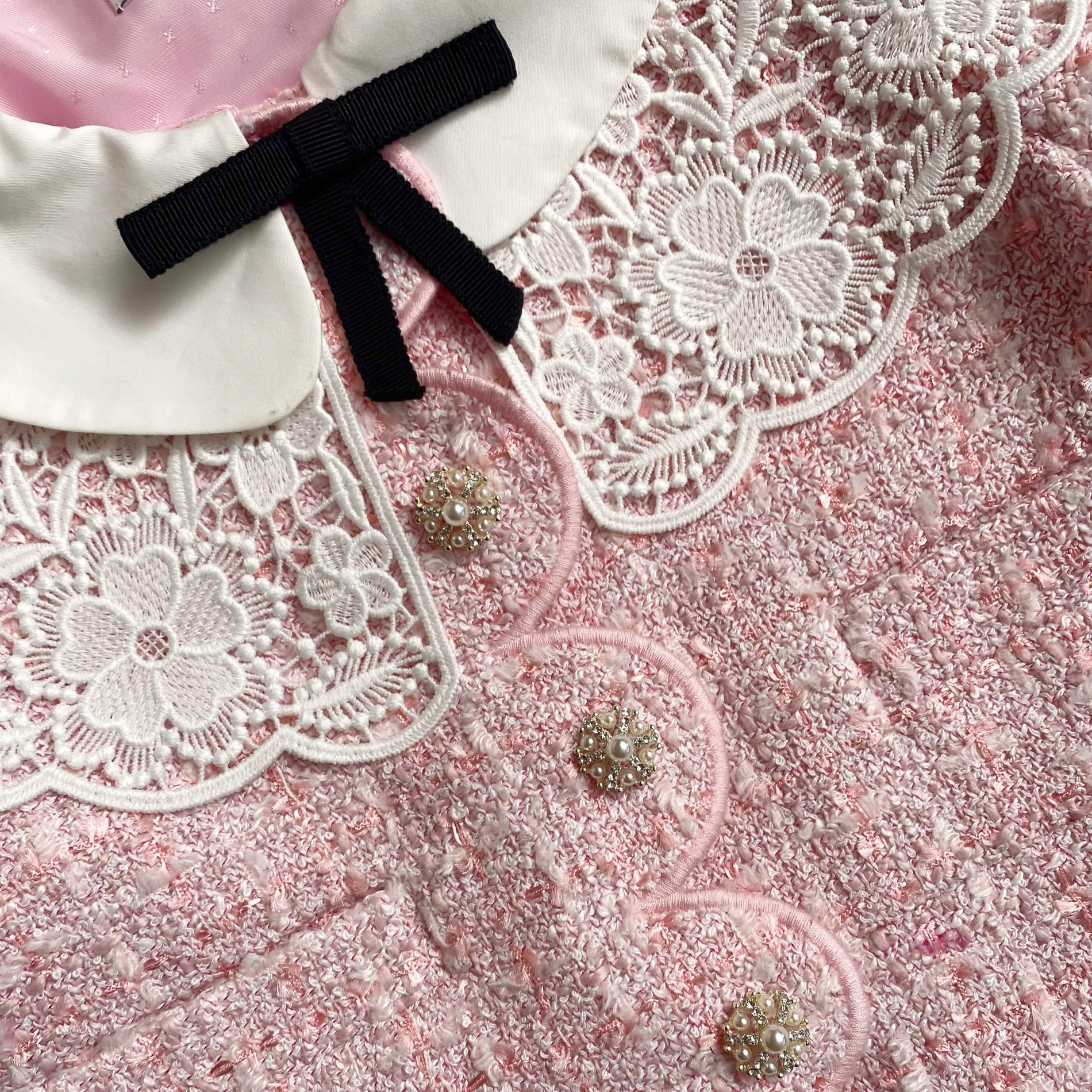 A close up of the fabric for the Pink Boucle Scalloped Hem Mini Dress