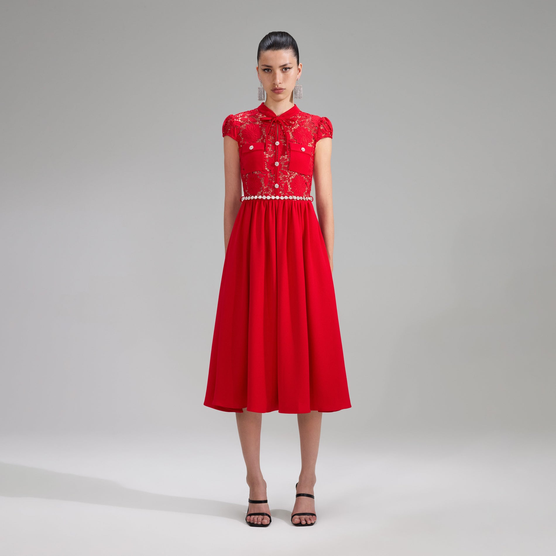 A woman wearing the Red Lace Cotton Midi Dress