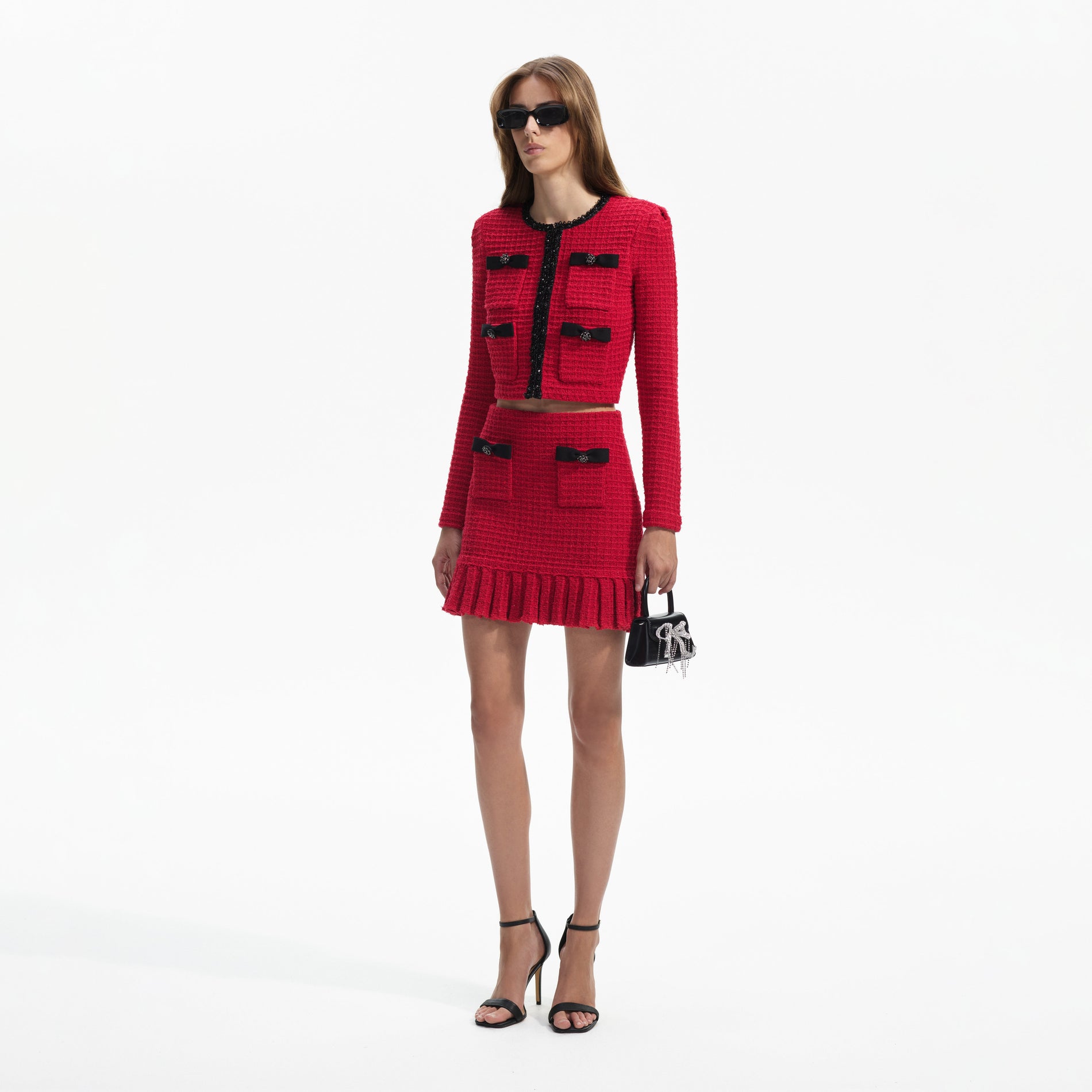 Side view of a woman wearing the Red Knit Mini Skirt