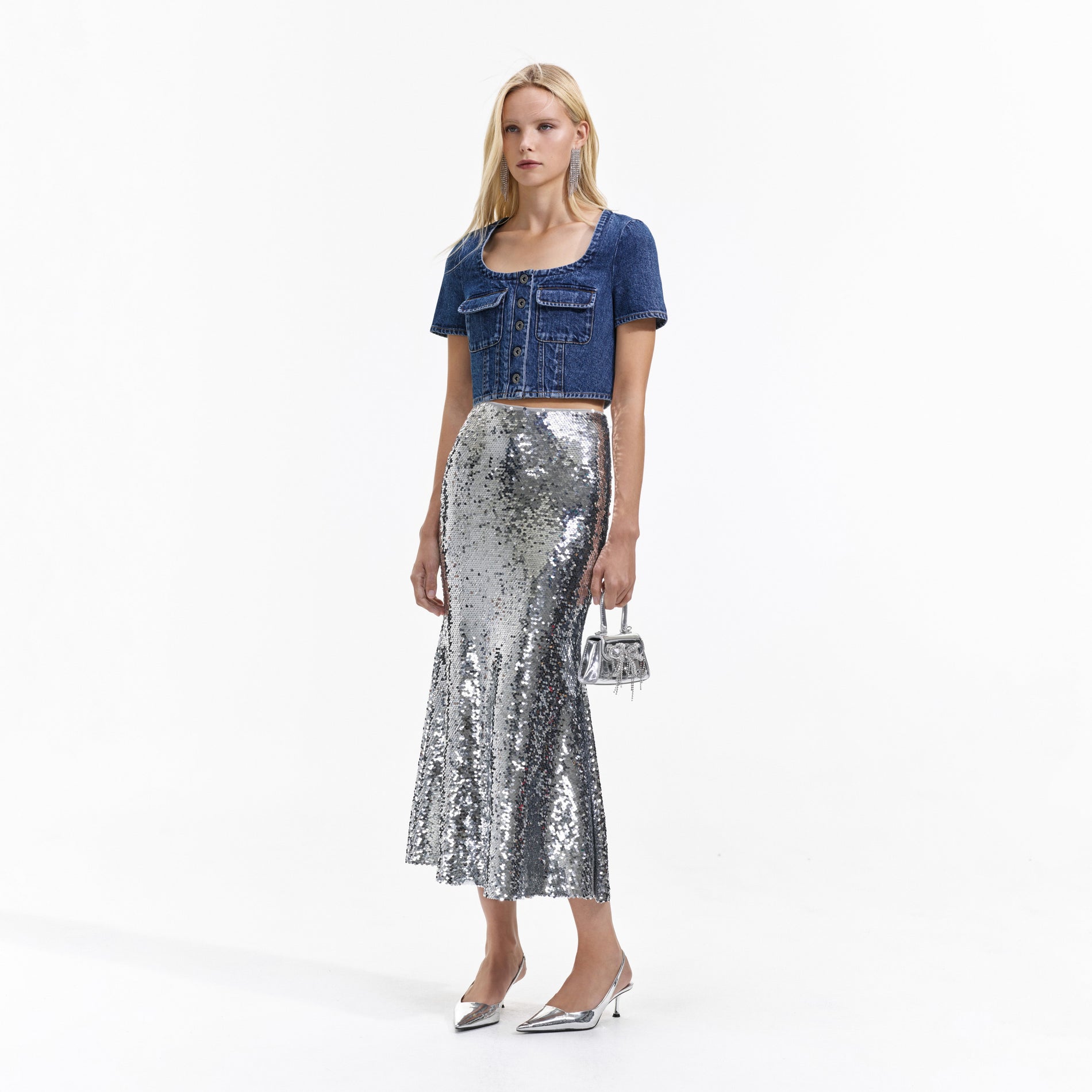 Side view of a woman wearing the Silver Sequin Maxi Skirt