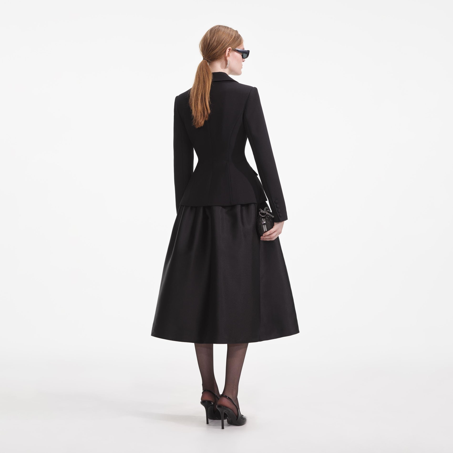 Back view of a woman wearing the Black Tailored Midi Dress