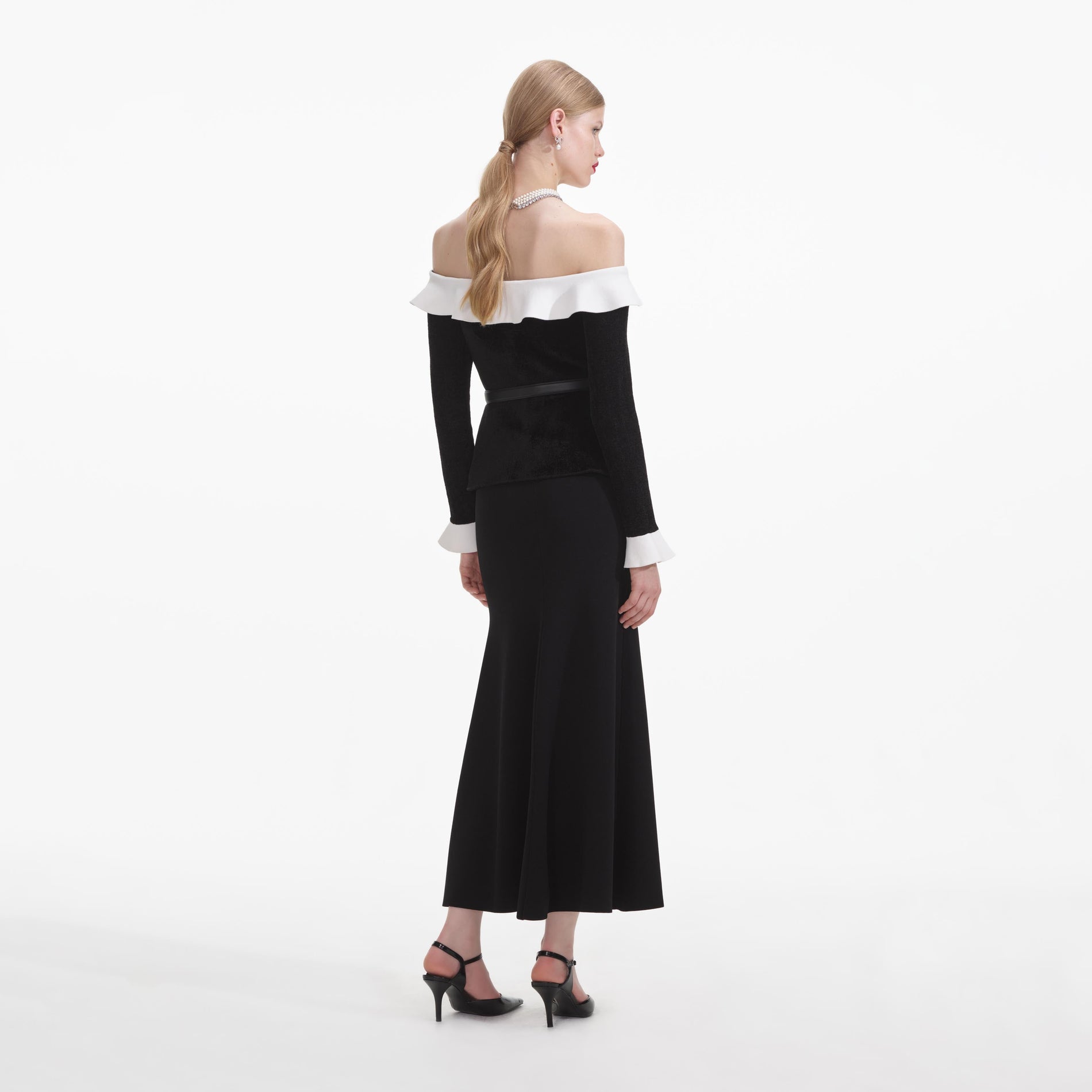 Back view of a woman wearing the Black Chenille Knit Off Shoulder Midi Dress