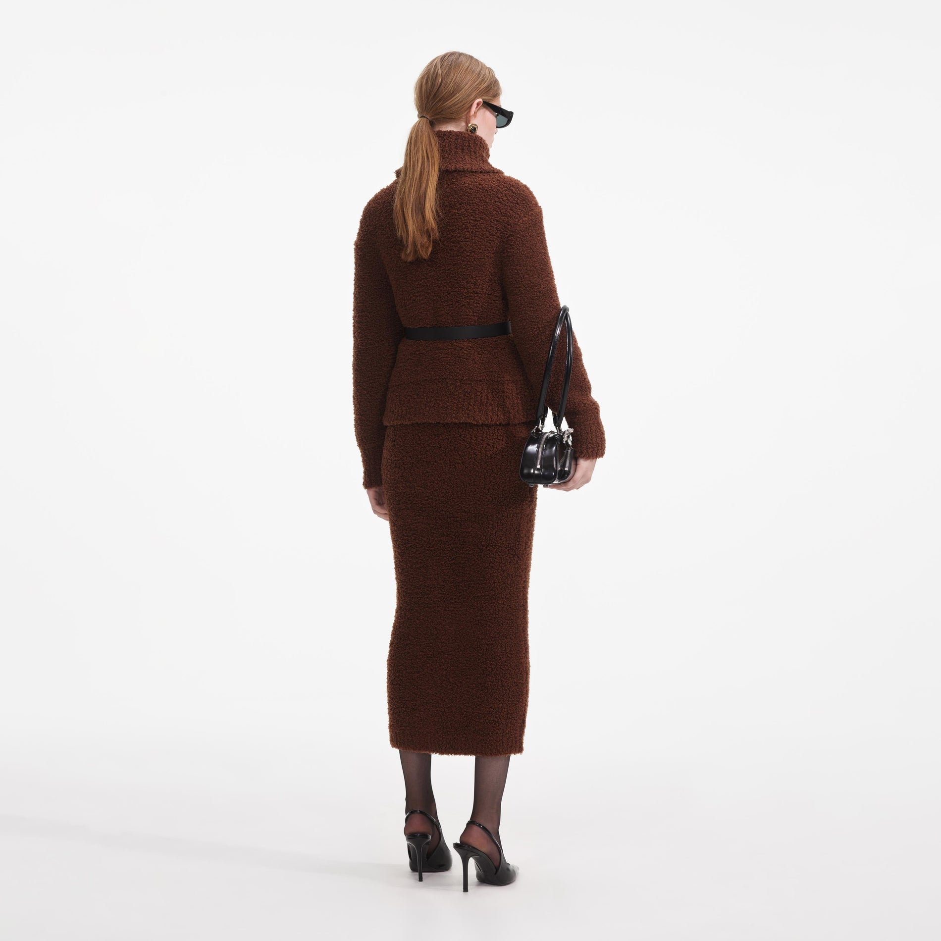 Back view of a woman wearing the Brown Fluffy Knit Midi Skirt