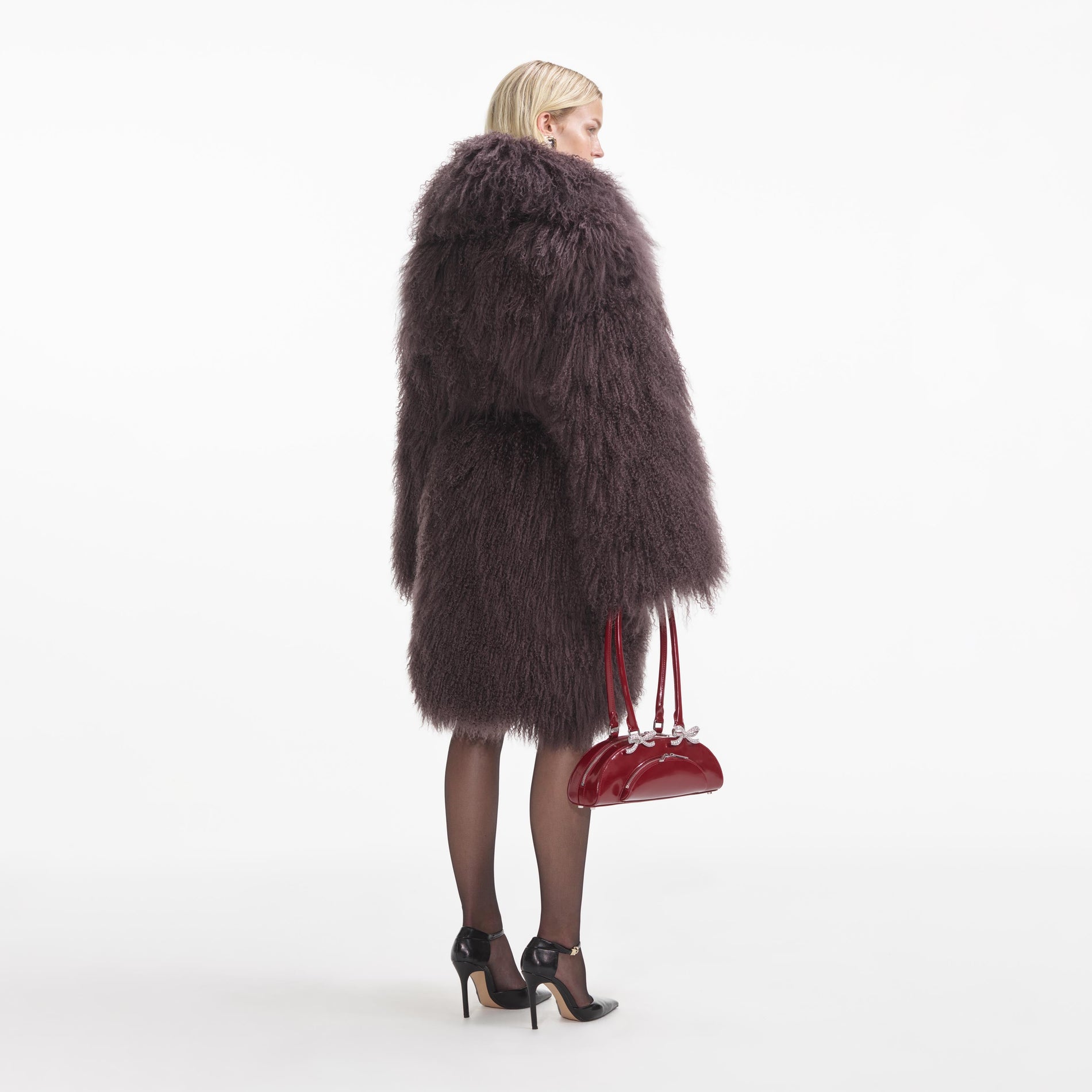 Back view of a woman wearing the Dark Brown Shearling Coat