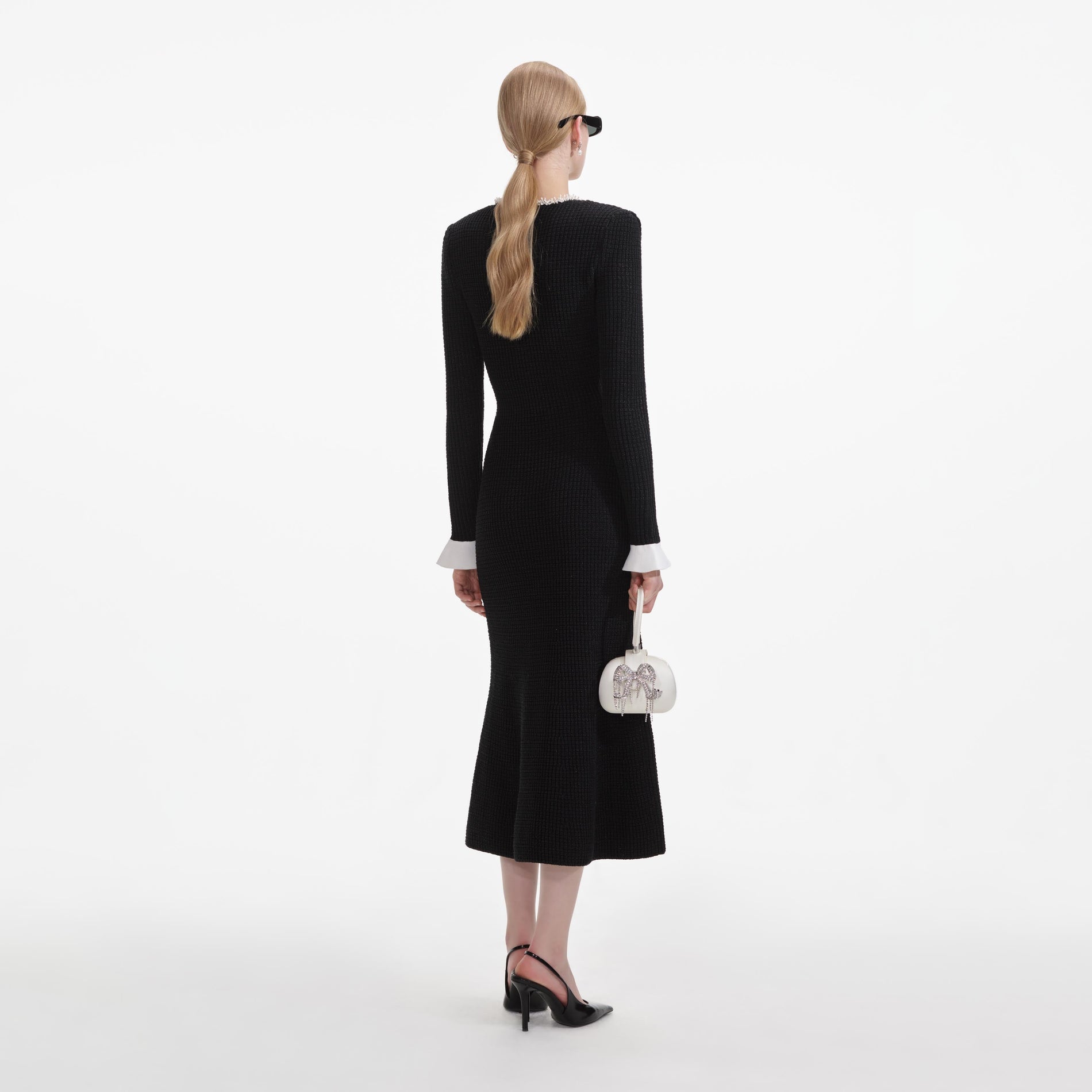 Back view of a woman wearing the Black Pearl Trim Knit Midi Dress