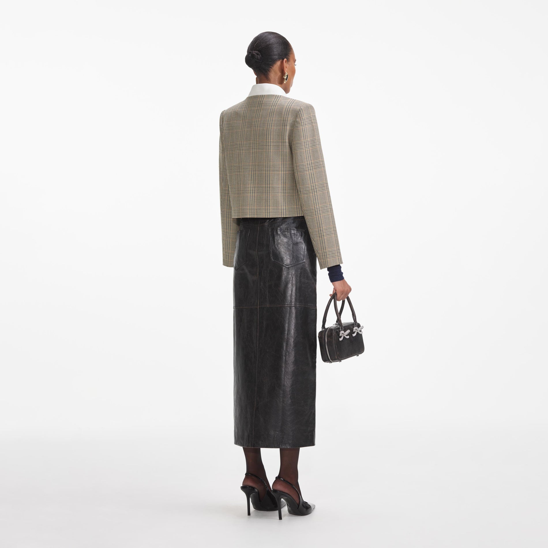 Back view of a woman wearing the Check Wool Jacket