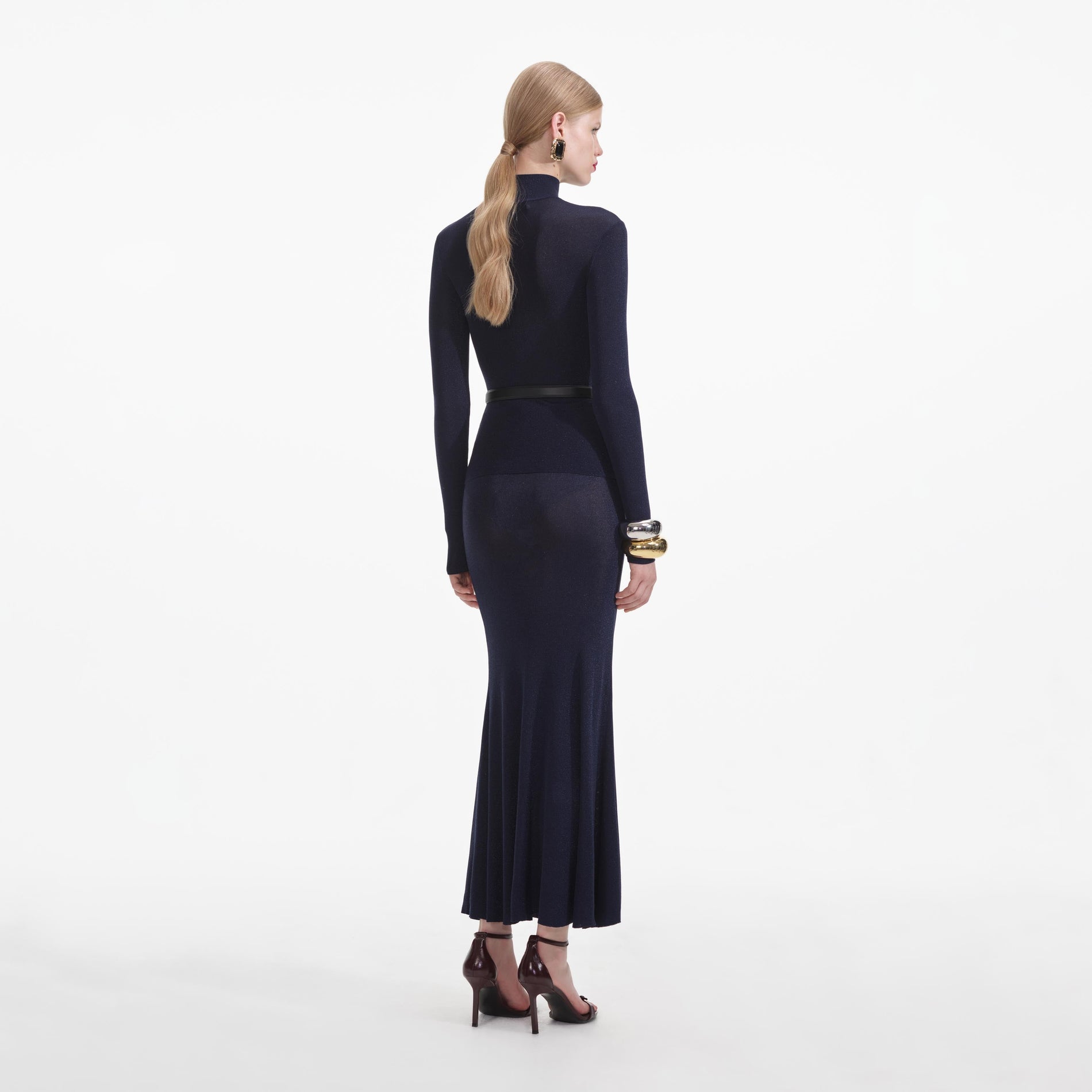 Back view of a woman wearing the Navy Viscose Knit Top