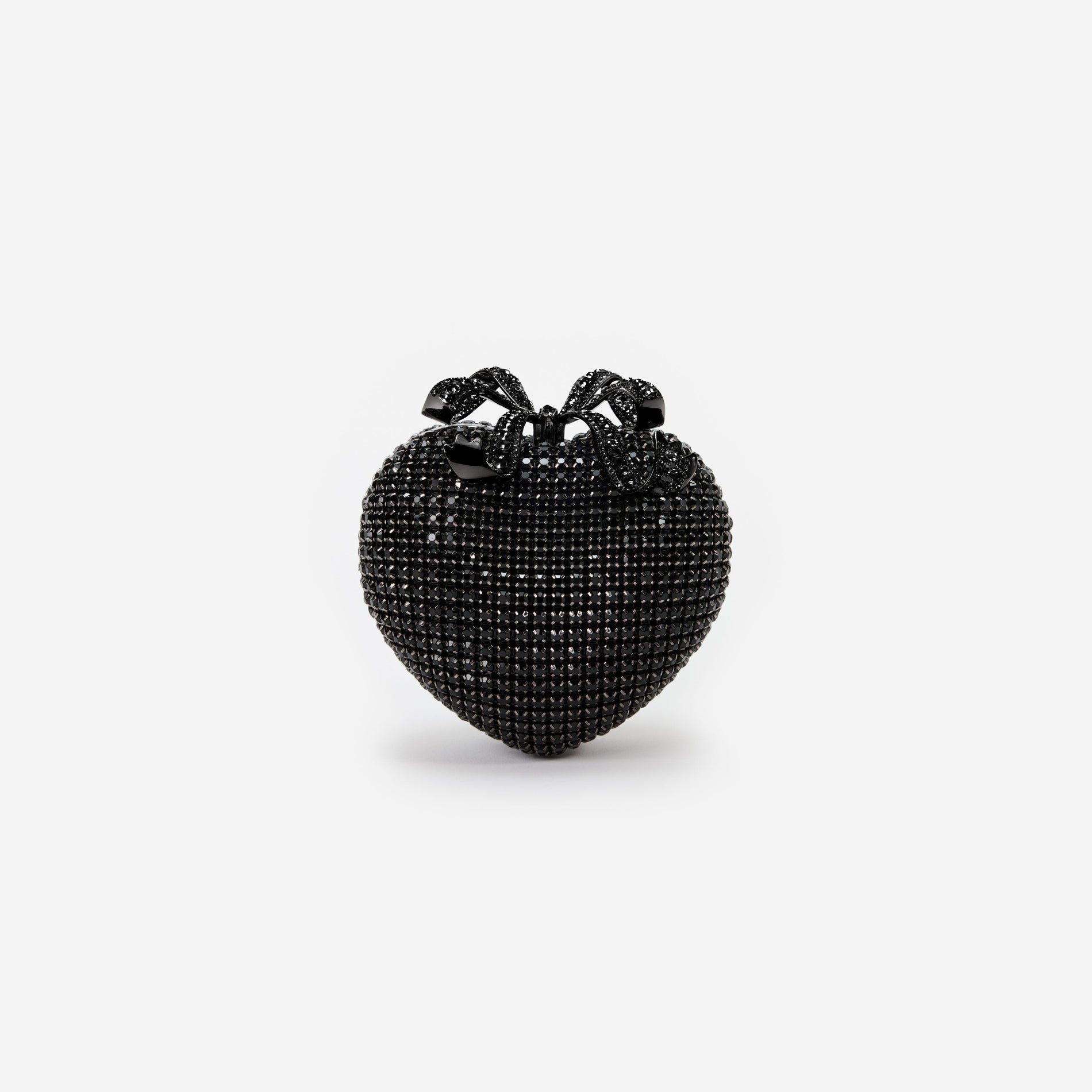 Front view of a woman wearing the Black Crystal Heart Clutch