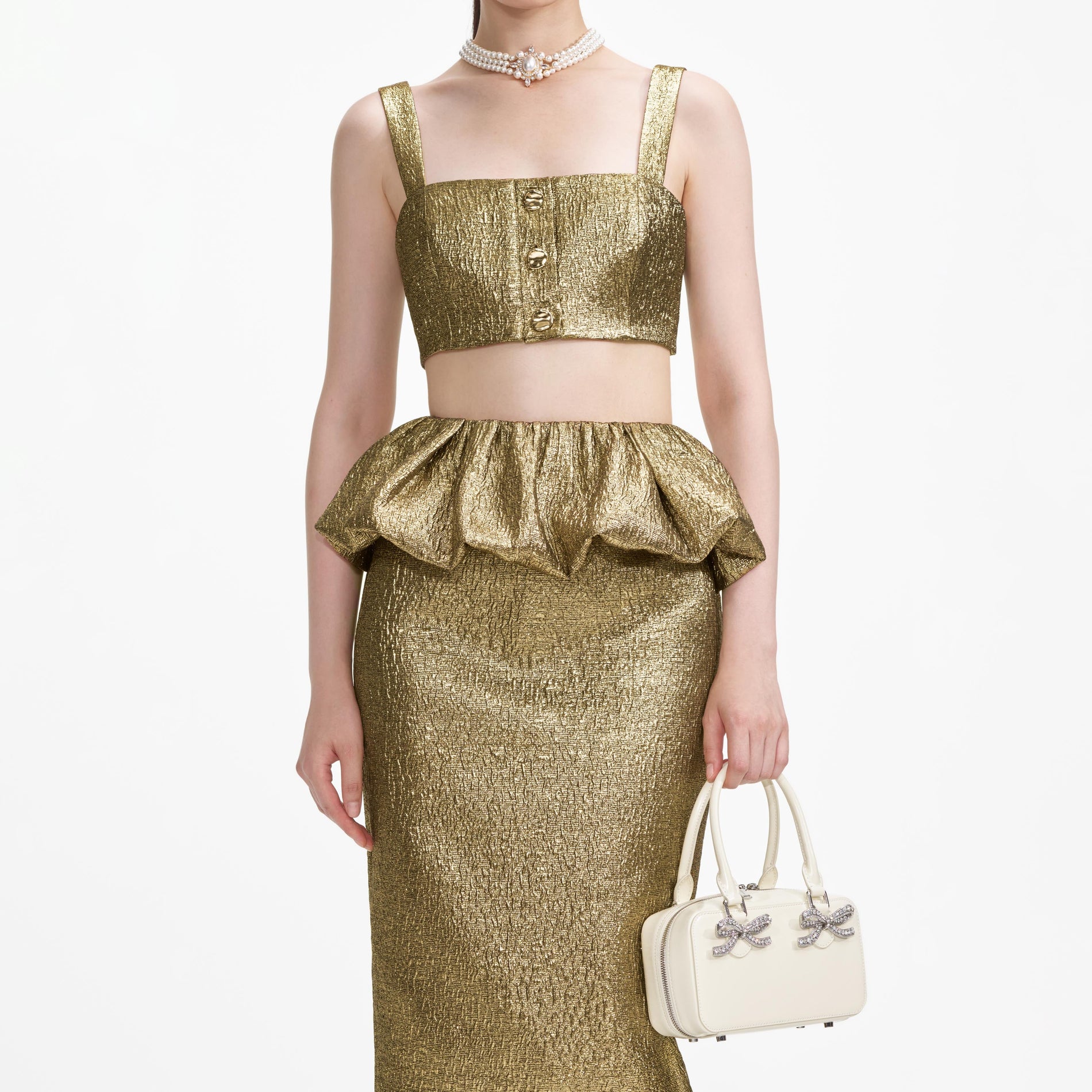 A close up of a woman wearing the Gold Metallic Jacquard Midi Skirt