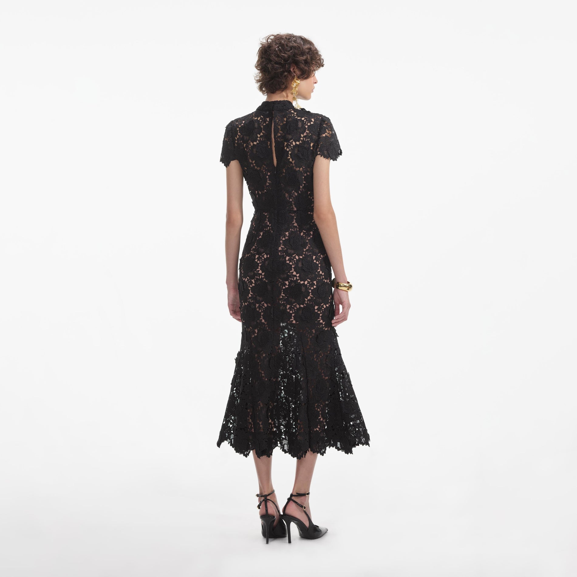 Back view of a woman wearing the White Black Flower Lace Midi Dress