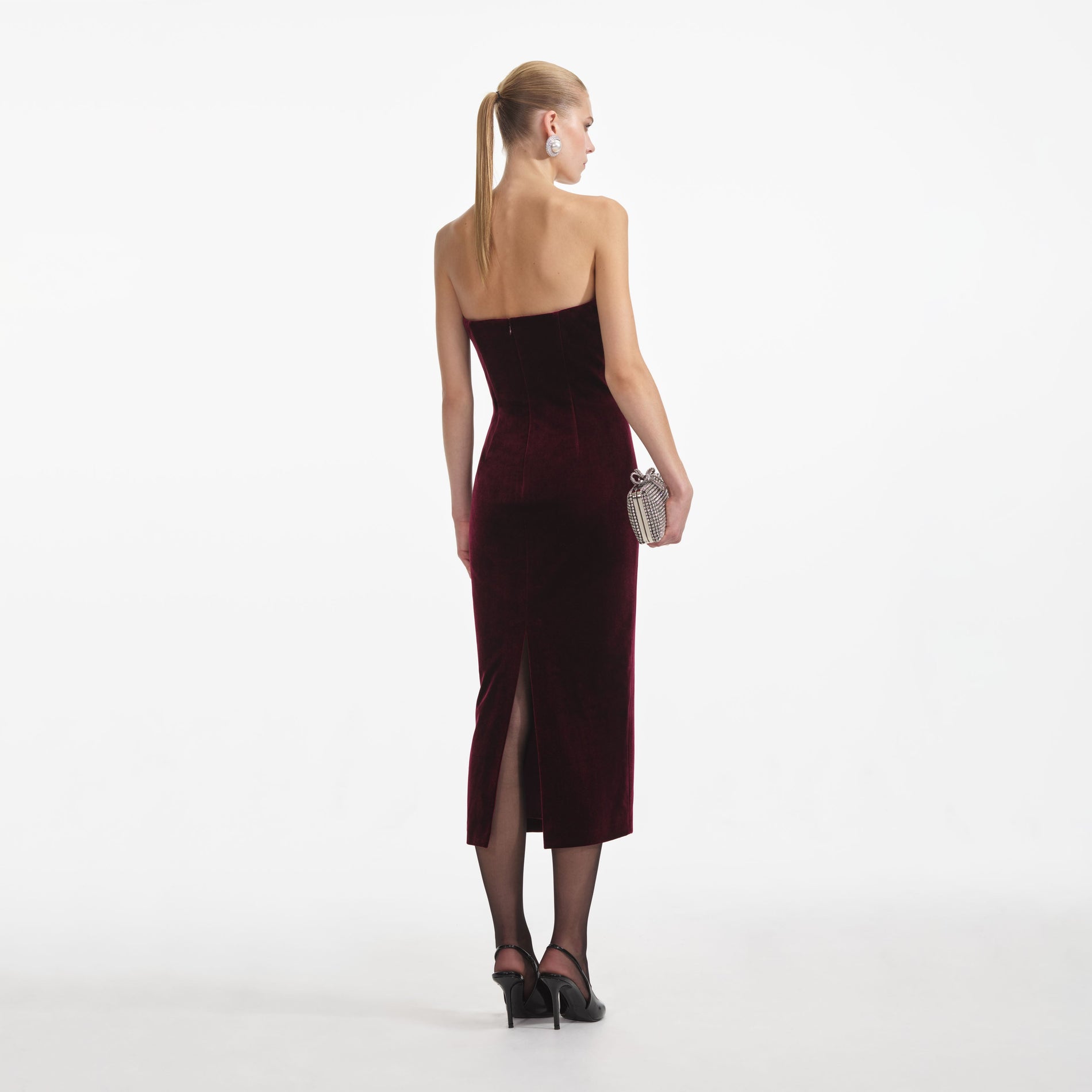 Back view of a woman wearing the Burgundy Velvet Midi Dress