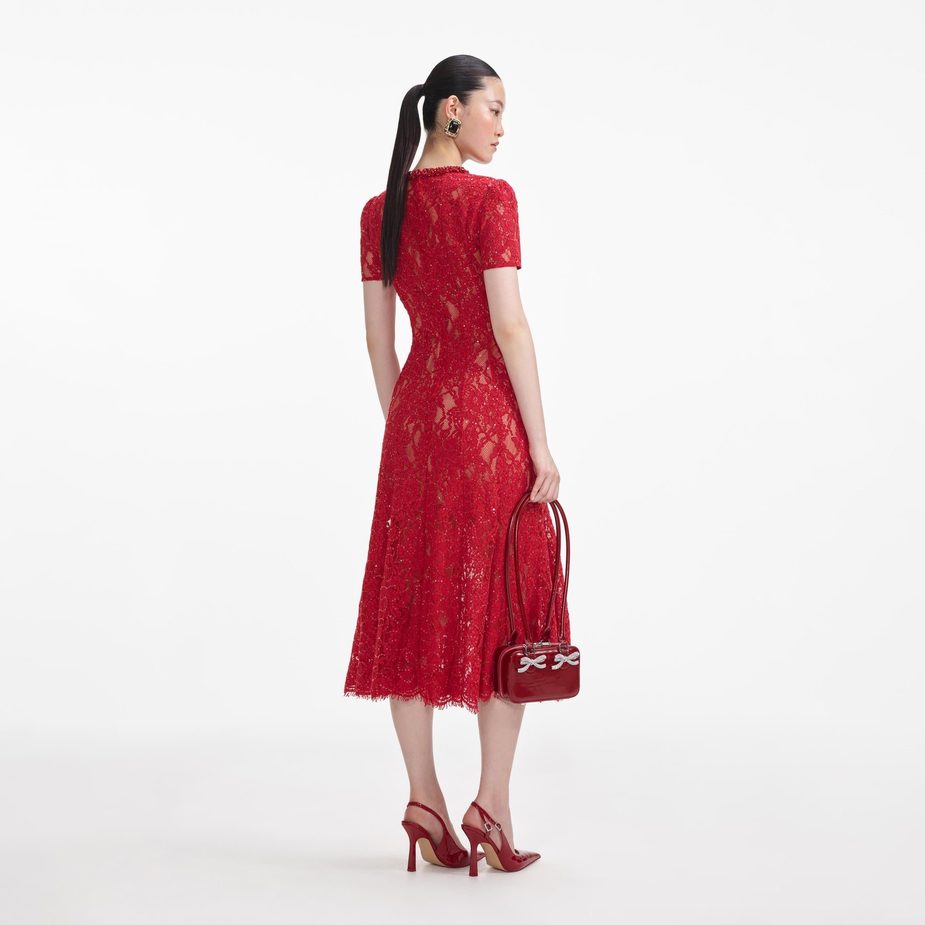 Back view of a woman wearing the Red Sequin Lace Midi Dress