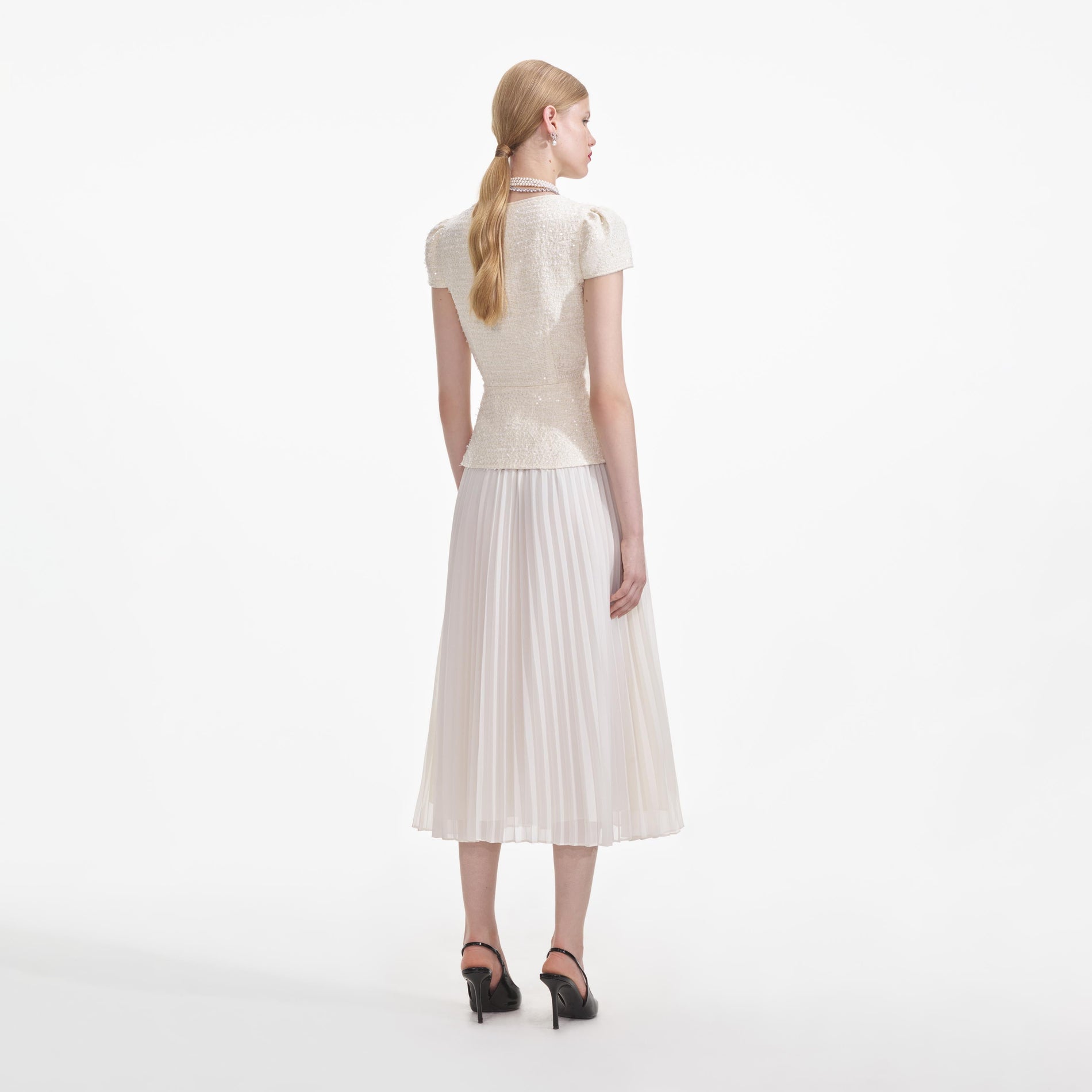 Back view of a woman wearing the Cream Boucle Bow Detail Midi Dress