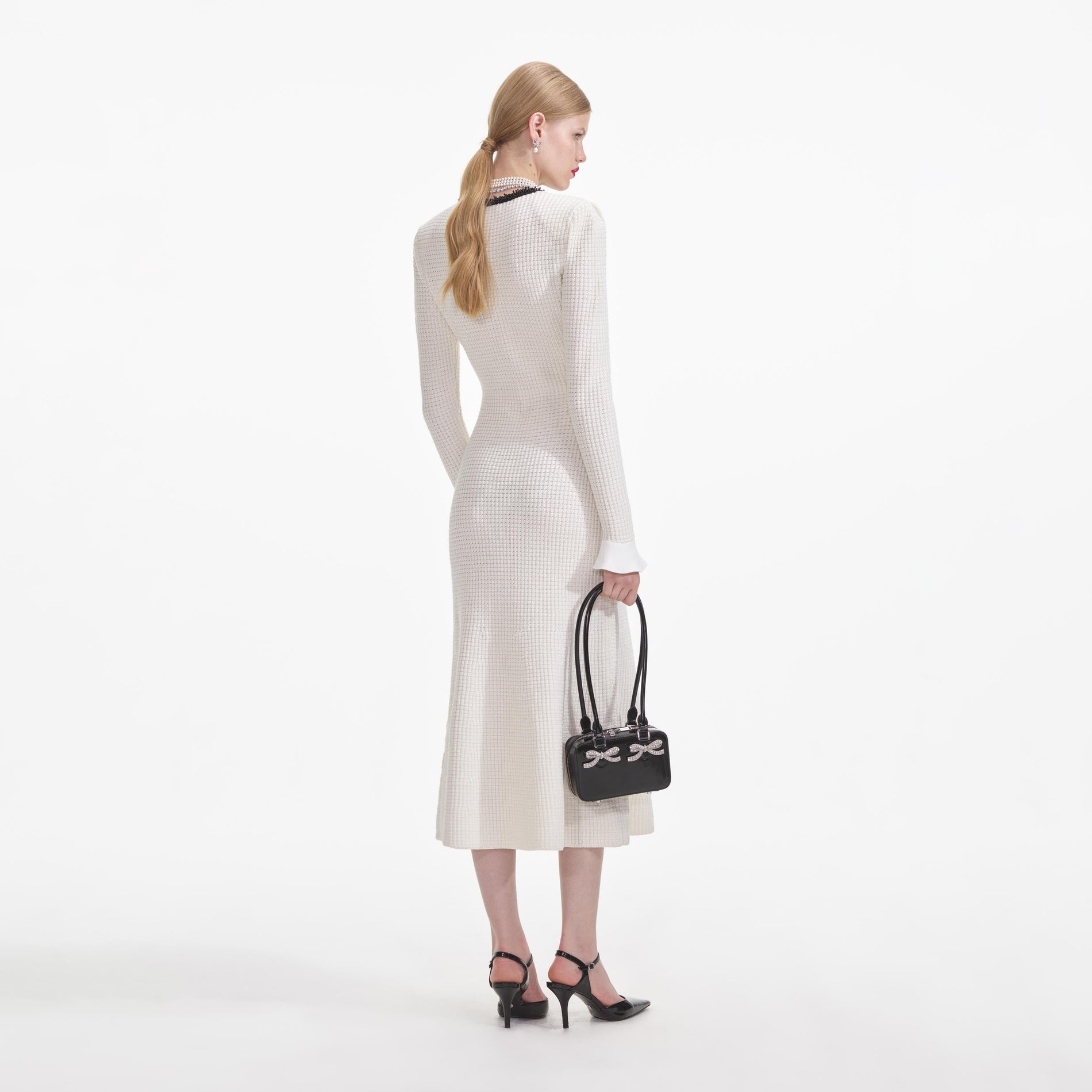 Back view of a woman wearing the White Knit Contrast Trim Midi Dress