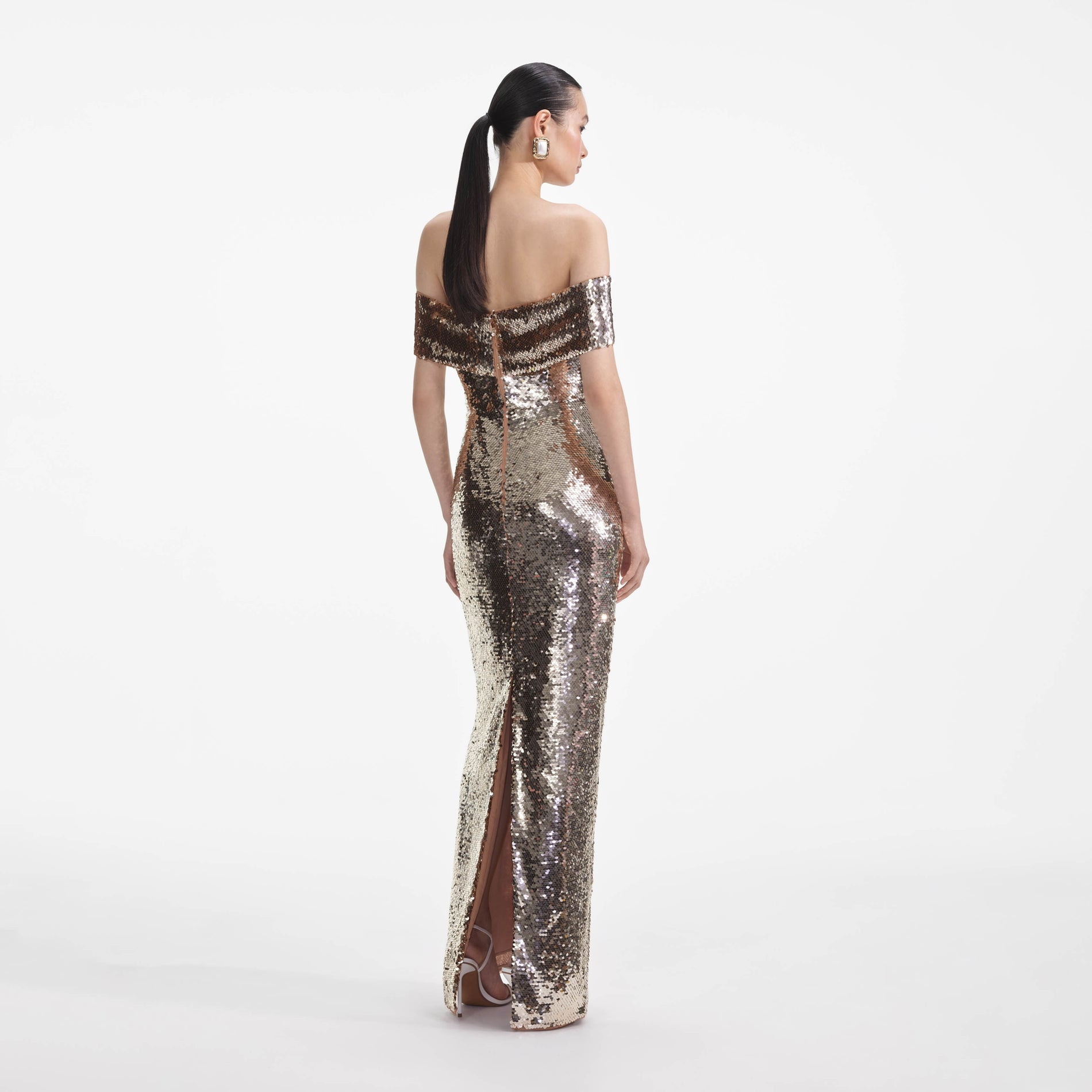 Back view of a woman wearing the Gold Sequin Maxi Dress