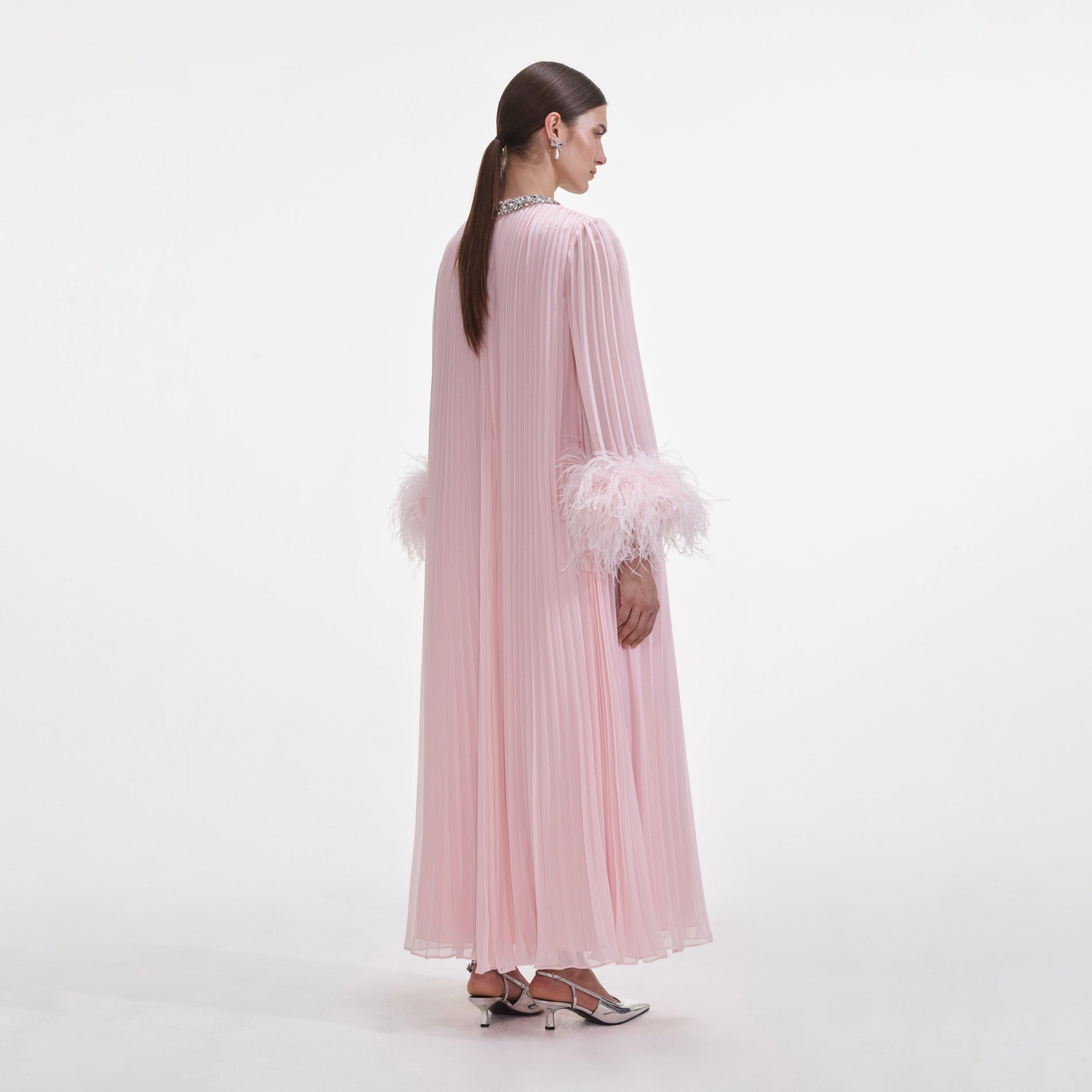 Back view of a woman wearing the Pink Chiffon Feather Midi Dress