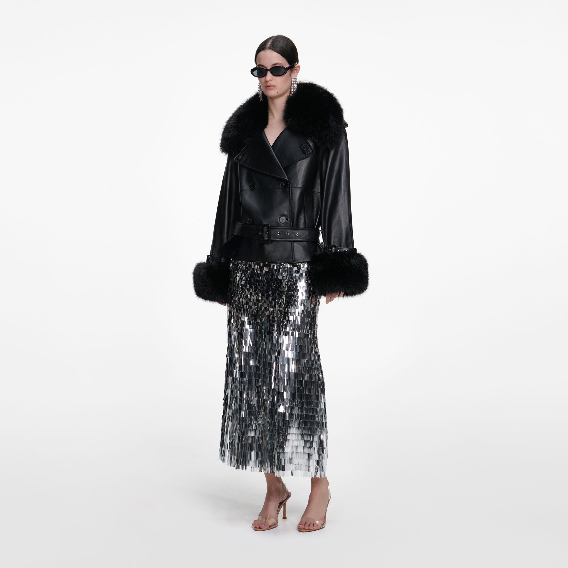 Side view of a woman wearing the Black Belted Leather Jacket