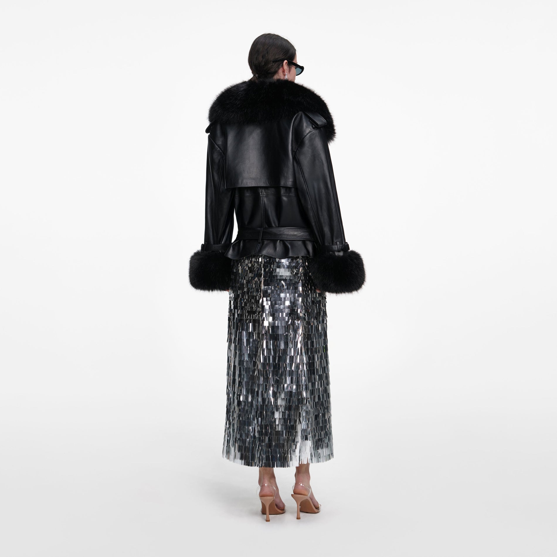 Back view of a woman wearing the Black Belted Leather Jacket