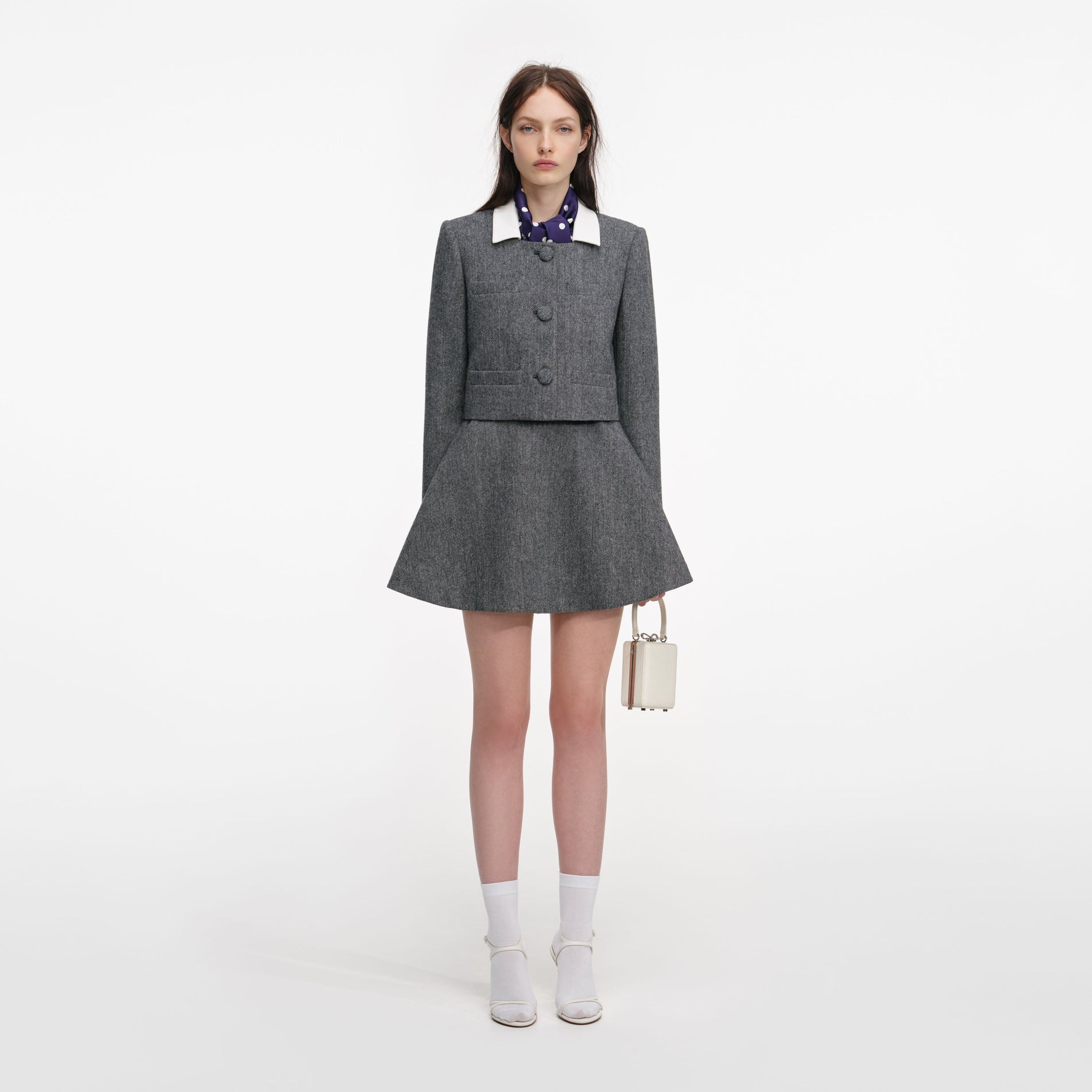 Front view of a woman wearing the Grey Herringbone Scarf Detail Jacket