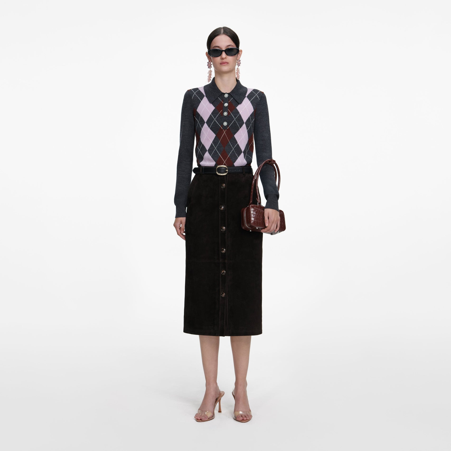 A close up of a woman wearing the Grey Argyle Lightweight Jumper