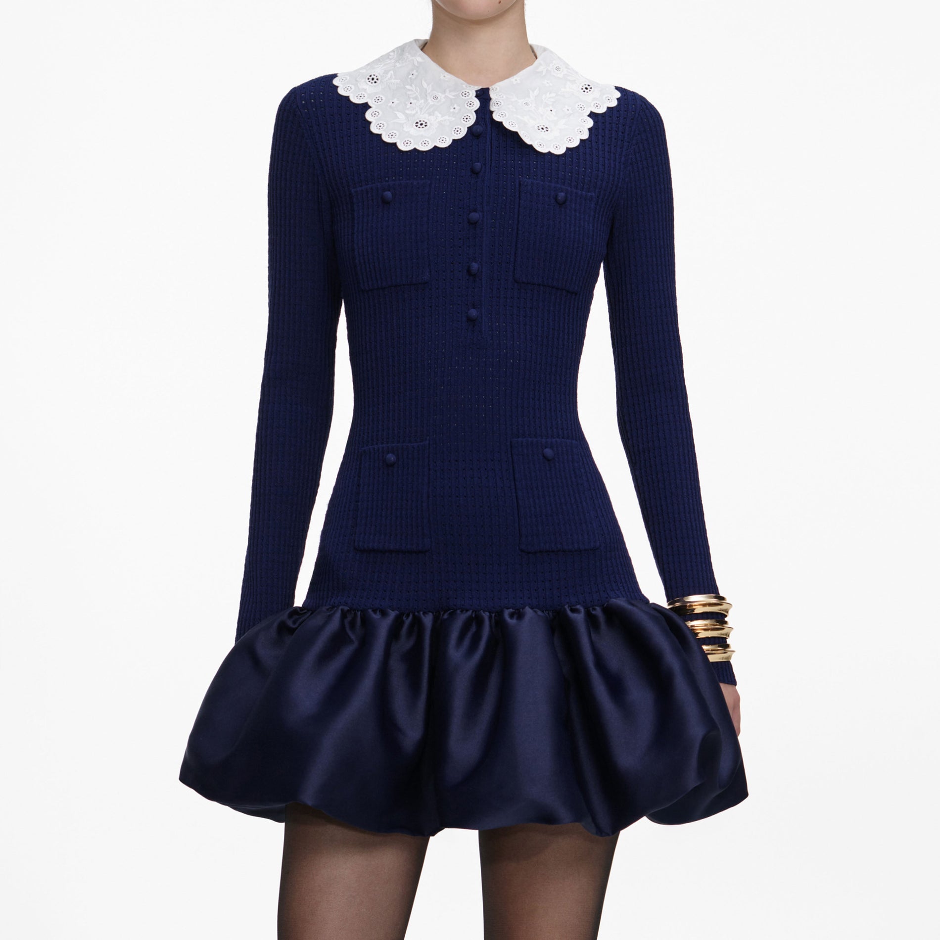 A close up of a woman wearing the Navy Knit Taffeta Mini Dress