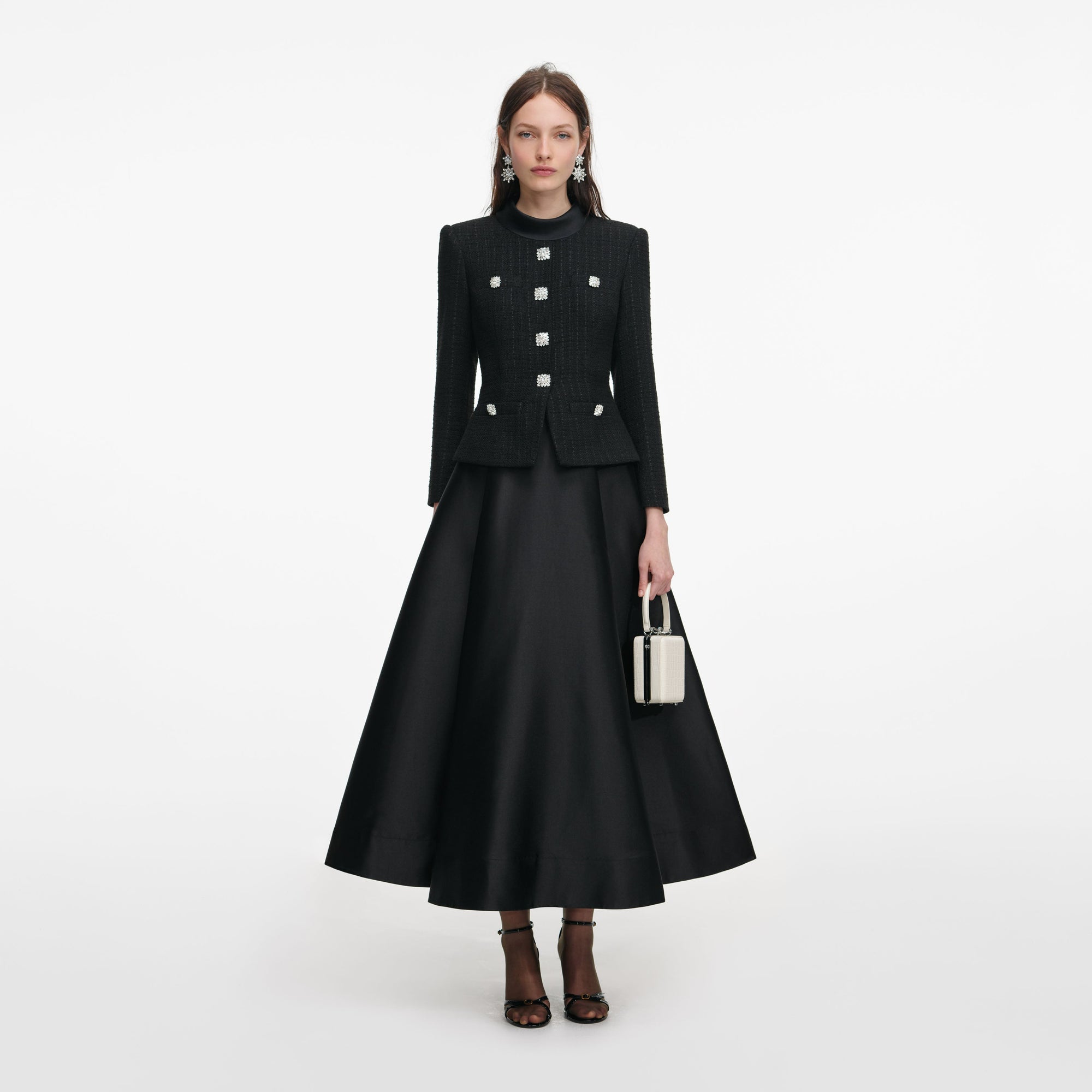 Front view of a woman wearing the Black Boucle Taffeta Midi Dress