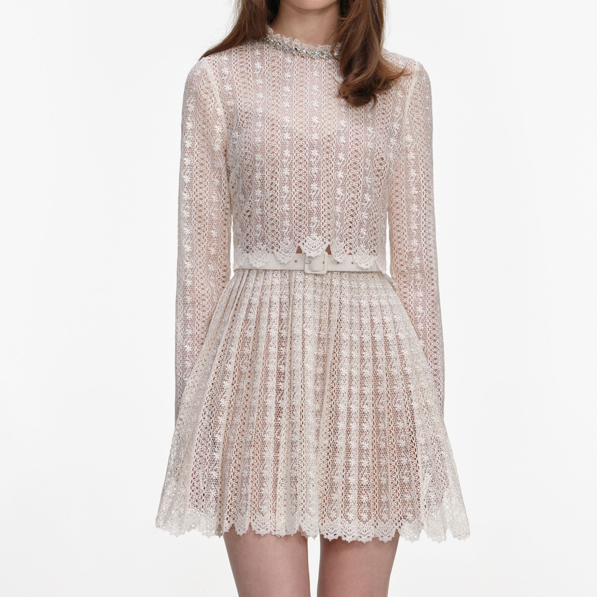 A close up of a woman wearing the Cream Organza Lace Mini Dress