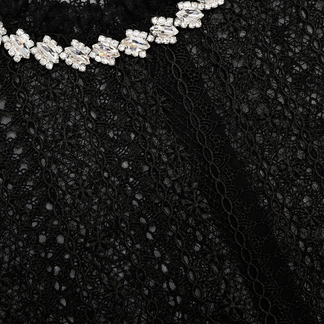 A close up of the fabric for the Black Organza Lace Top
