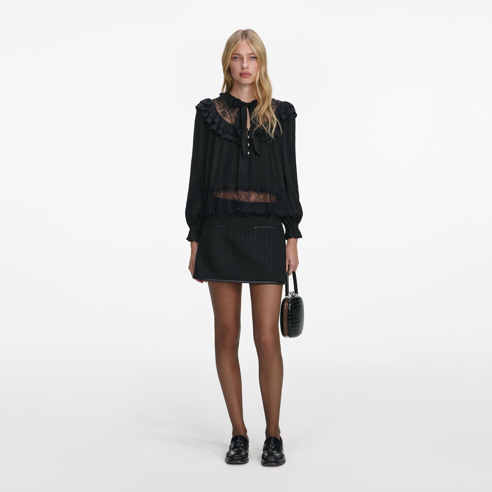 Front view of a woman wearing the Black Viscose Lace Blouse