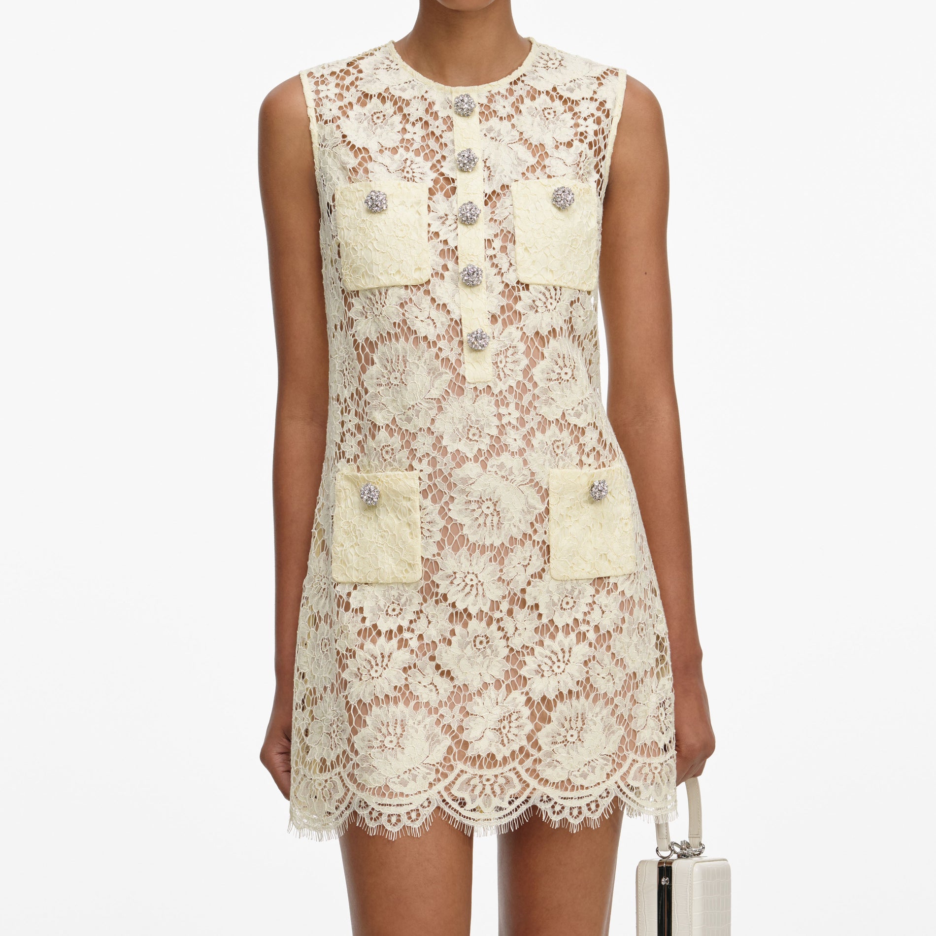 A close up of a woman wearing the Yellow Fine Lace Mini Dress