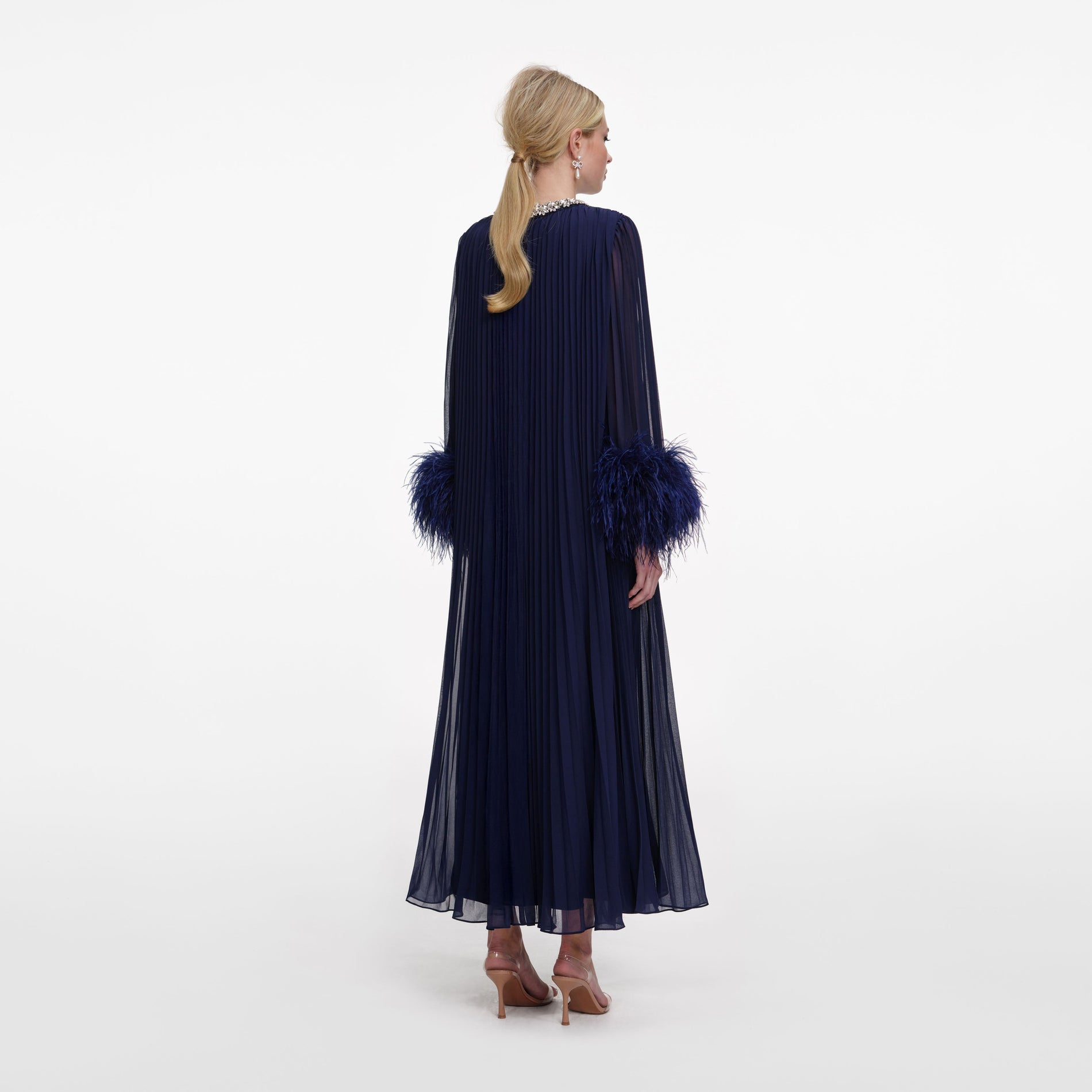 Back view of a woman wearing the Navy Chiffon Feather Midi Dress