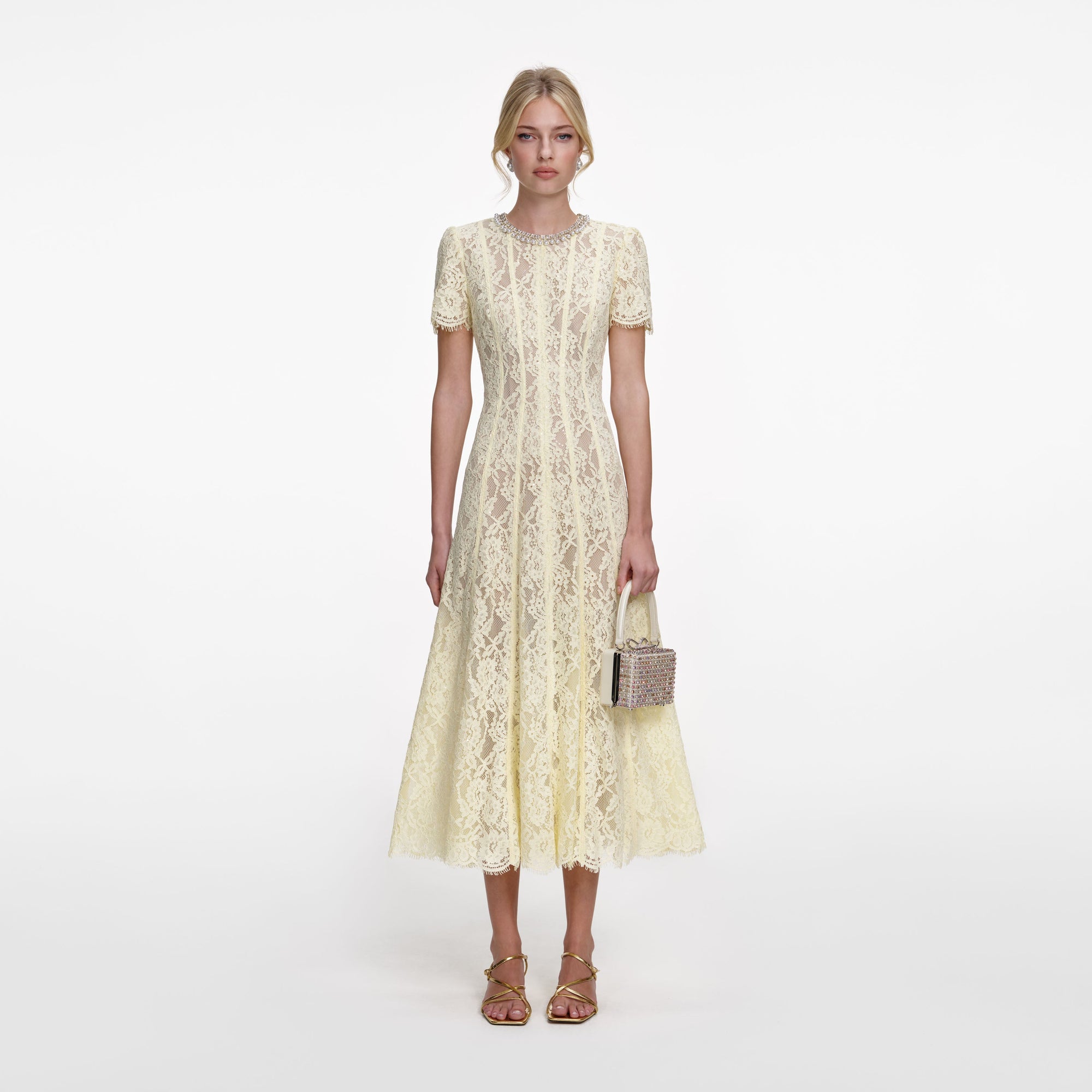 Front view of a woman wearing the Yellow Lace Embellished Midi Dress