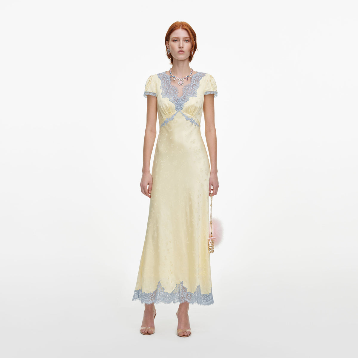 Front view of a woman wearing the Yellow Viscose Lace Midi Dress