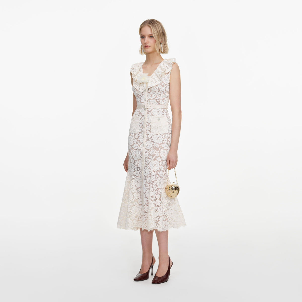 Side view of a woman wearing the Cream Lace Flower Midi Dress